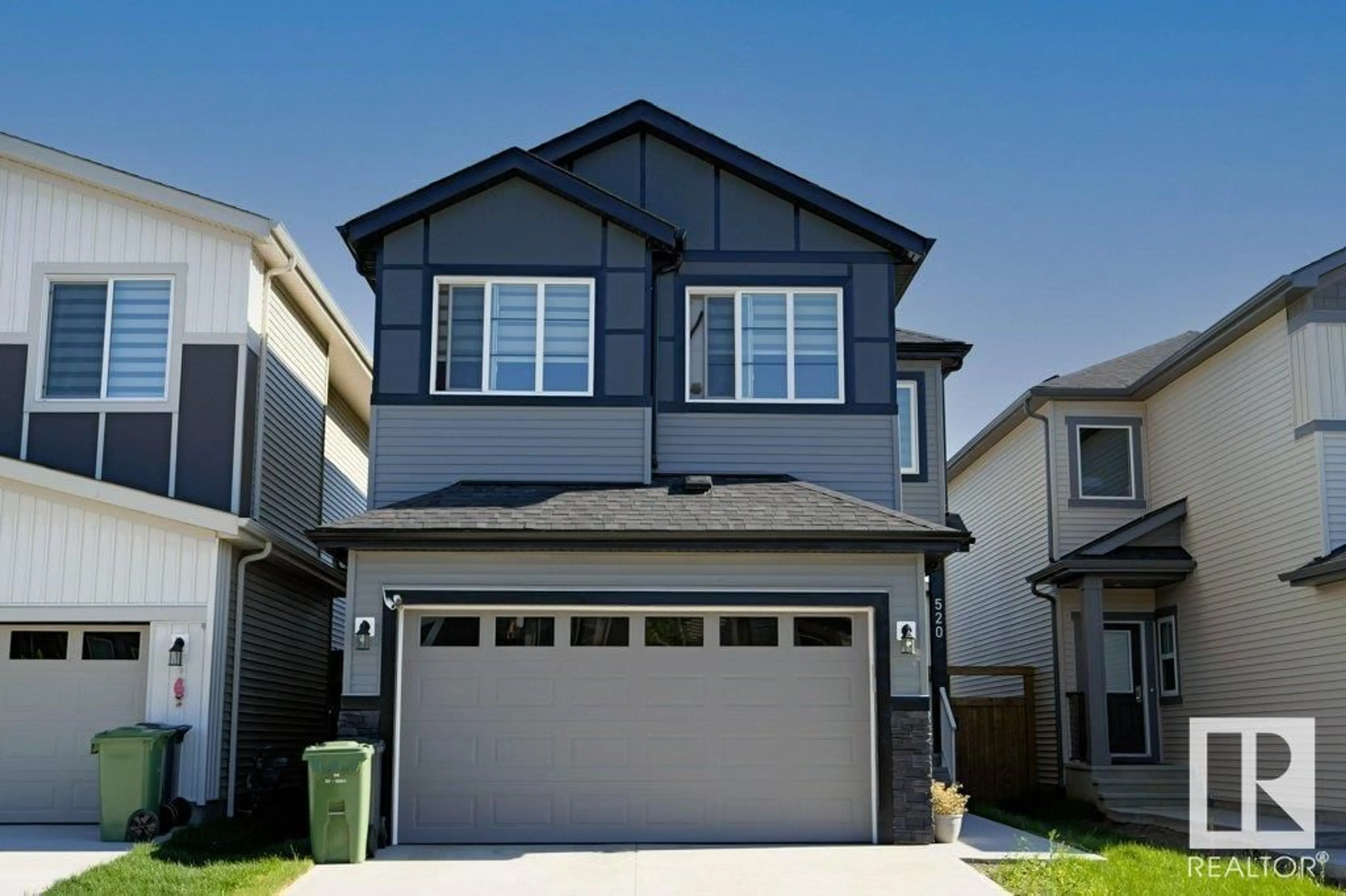 Home with vinyl exterior material, street for 520 BLUFF LN, Leduc Alberta T9E1R5
