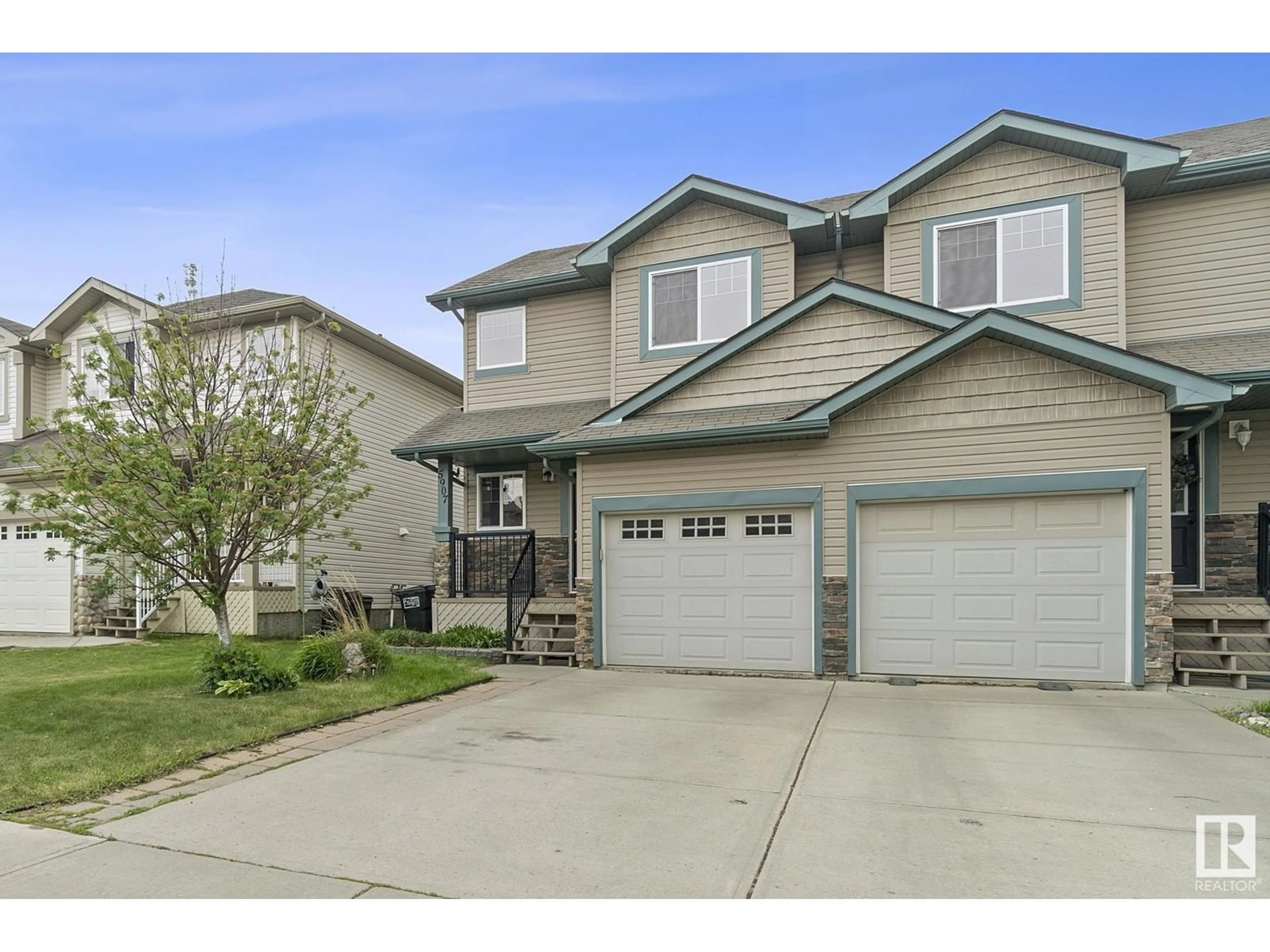 Home with vinyl exterior material, street for SW - 5907 8 AV, Edmonton Alberta T6X0G5