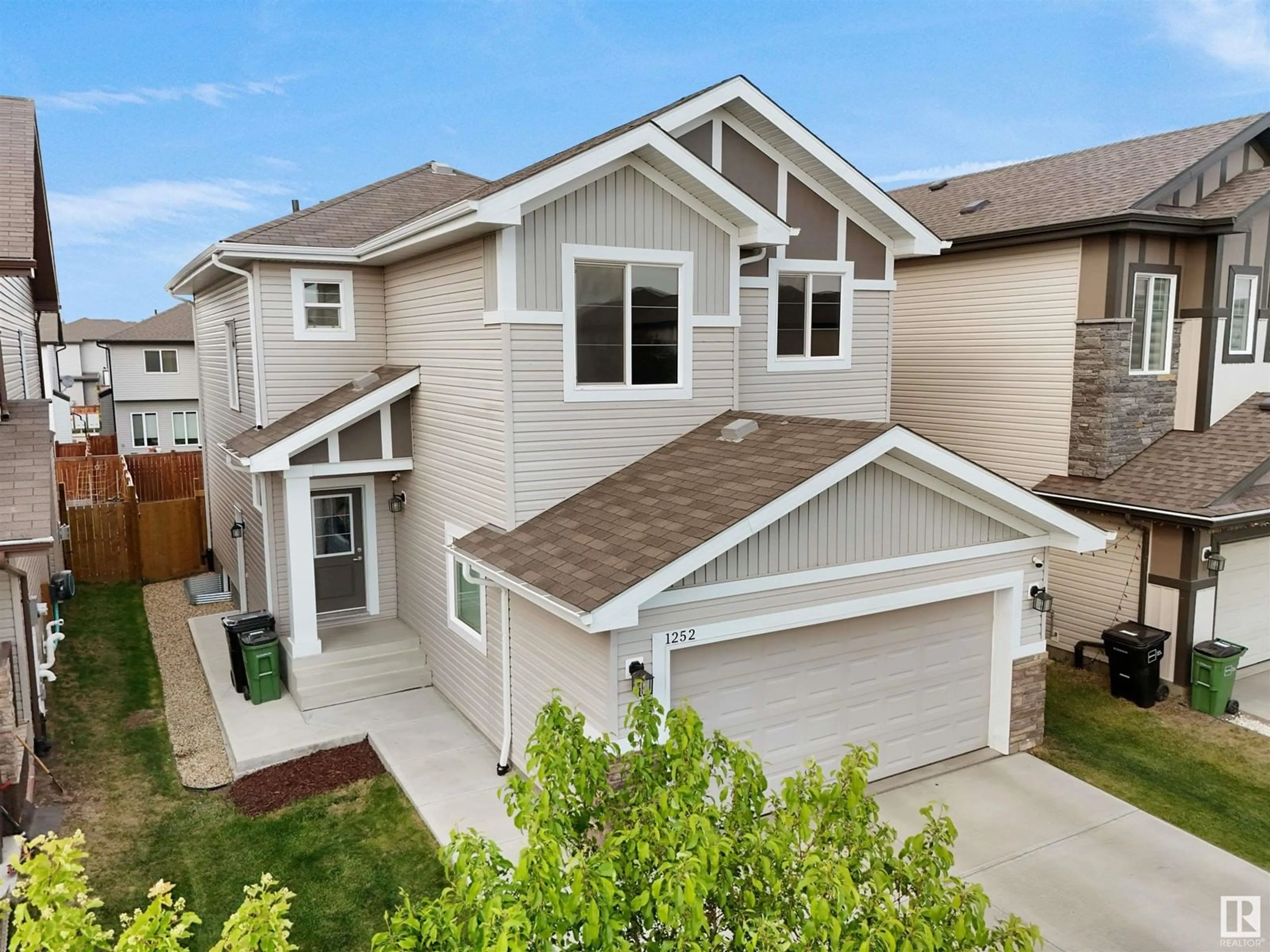 Home with vinyl exterior material, street for 1252 25 AV, Edmonton Alberta T6T2E5