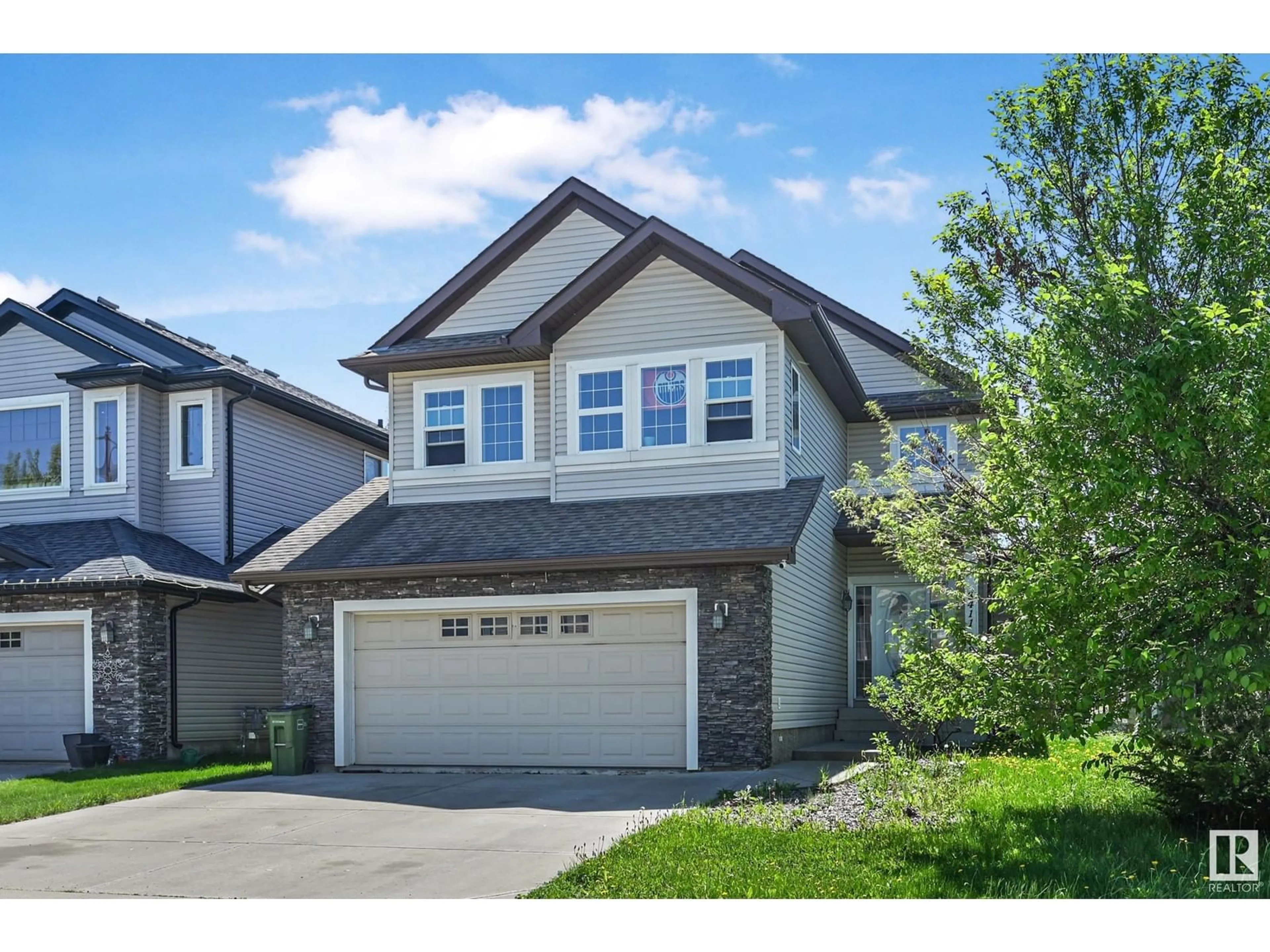 Home with vinyl exterior material, street for 8411 SLOANE CR, Edmonton Alberta T6R0L4