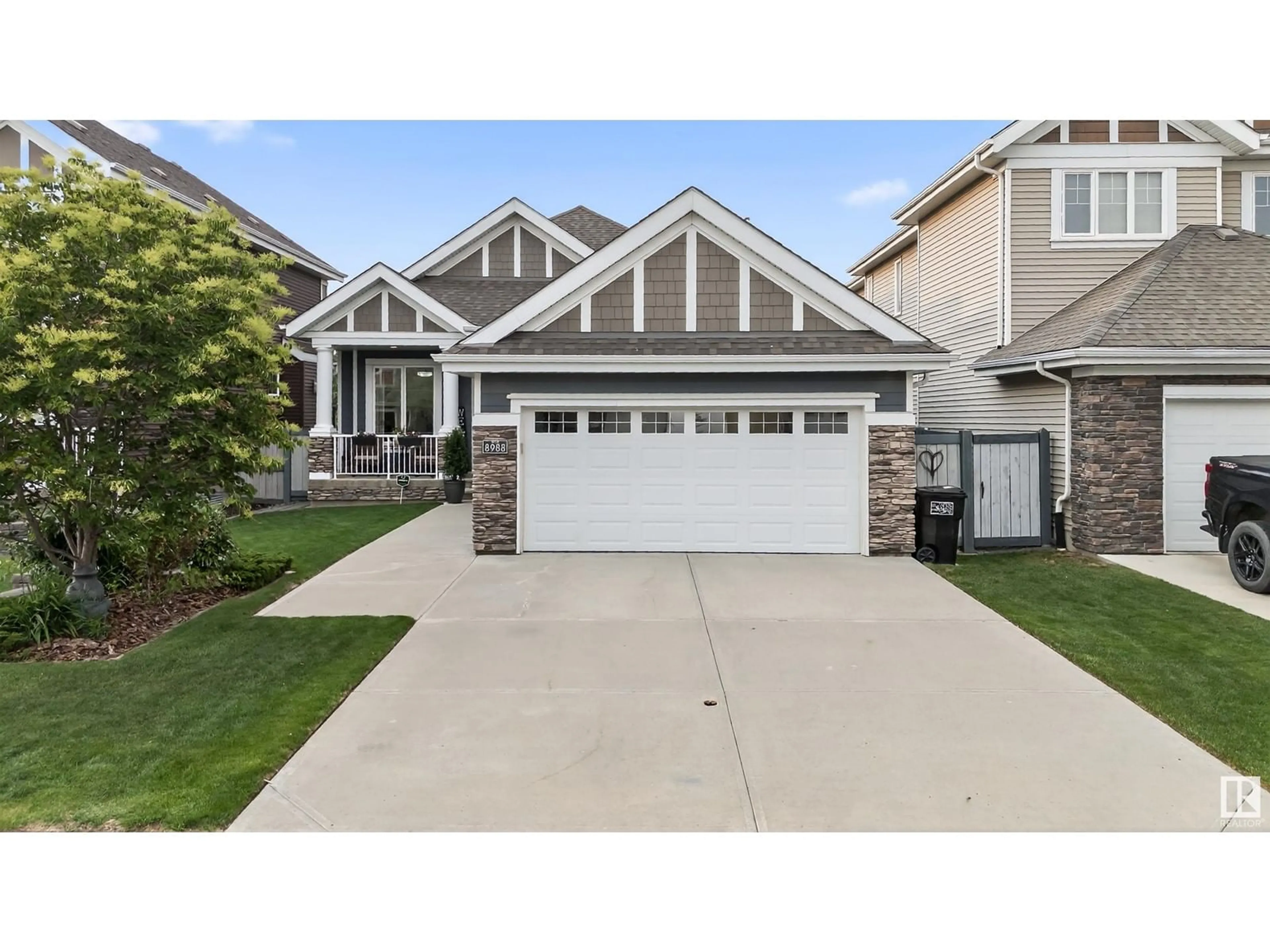 Home with vinyl exterior material, street for 8988 24 AV, Edmonton Alberta T6X1A6