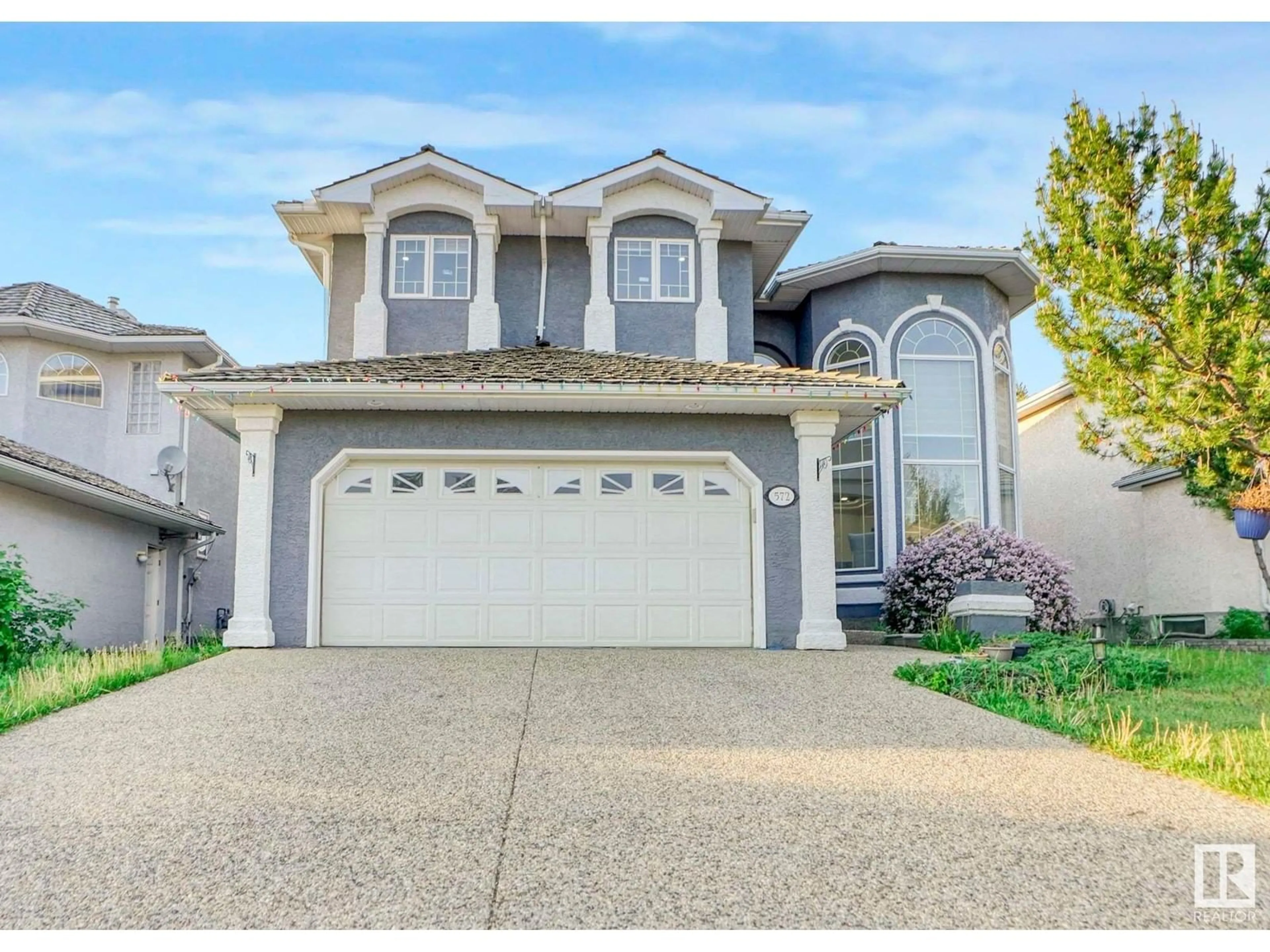 Home with vinyl exterior material, street for 572 BUTTERWORTH WY, Edmonton Alberta T6R2P6