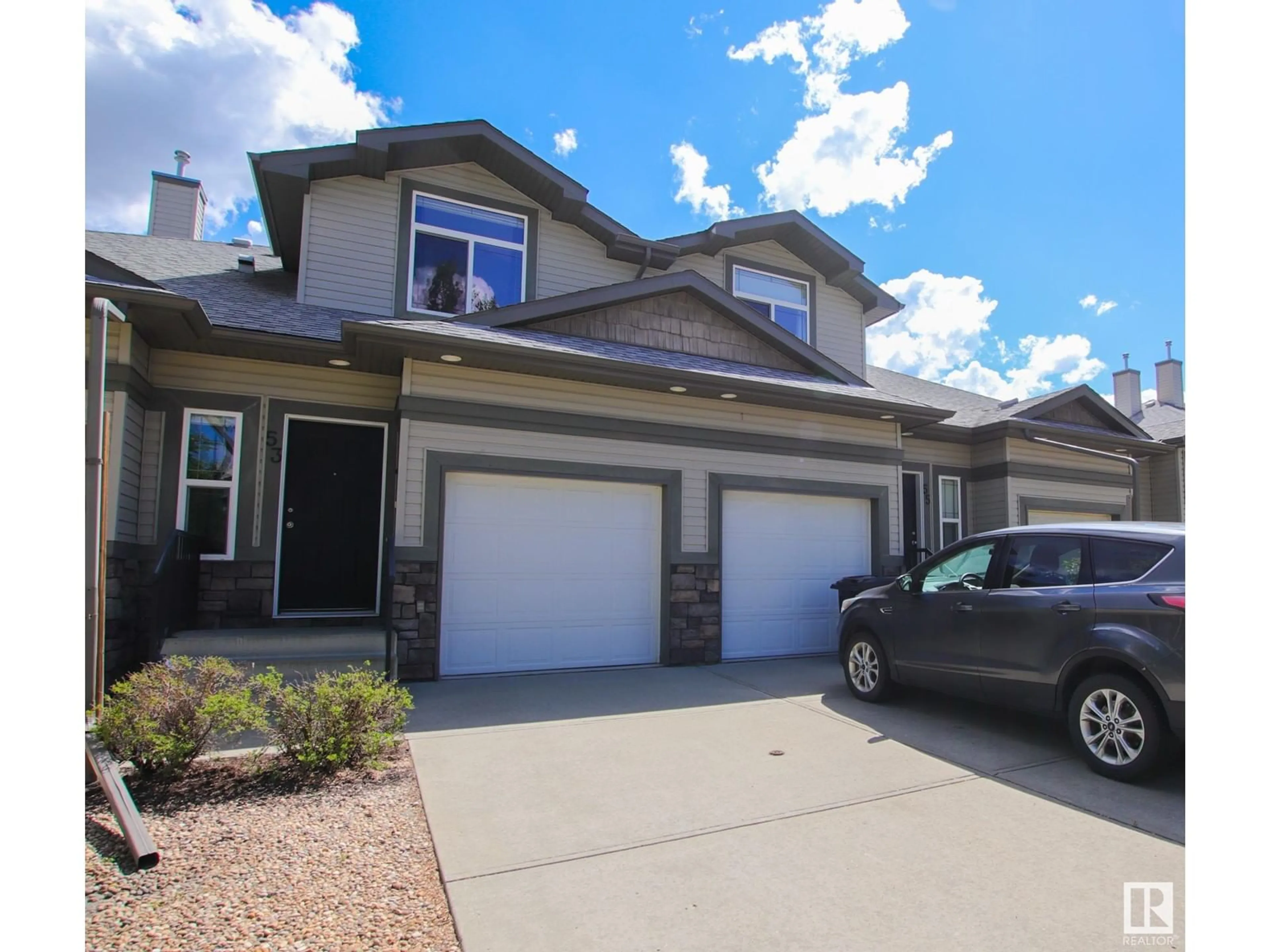 Home with vinyl exterior material, street for 10 - 53 WOODCREST LN, Fort Saskatchewan Alberta T8L0C7