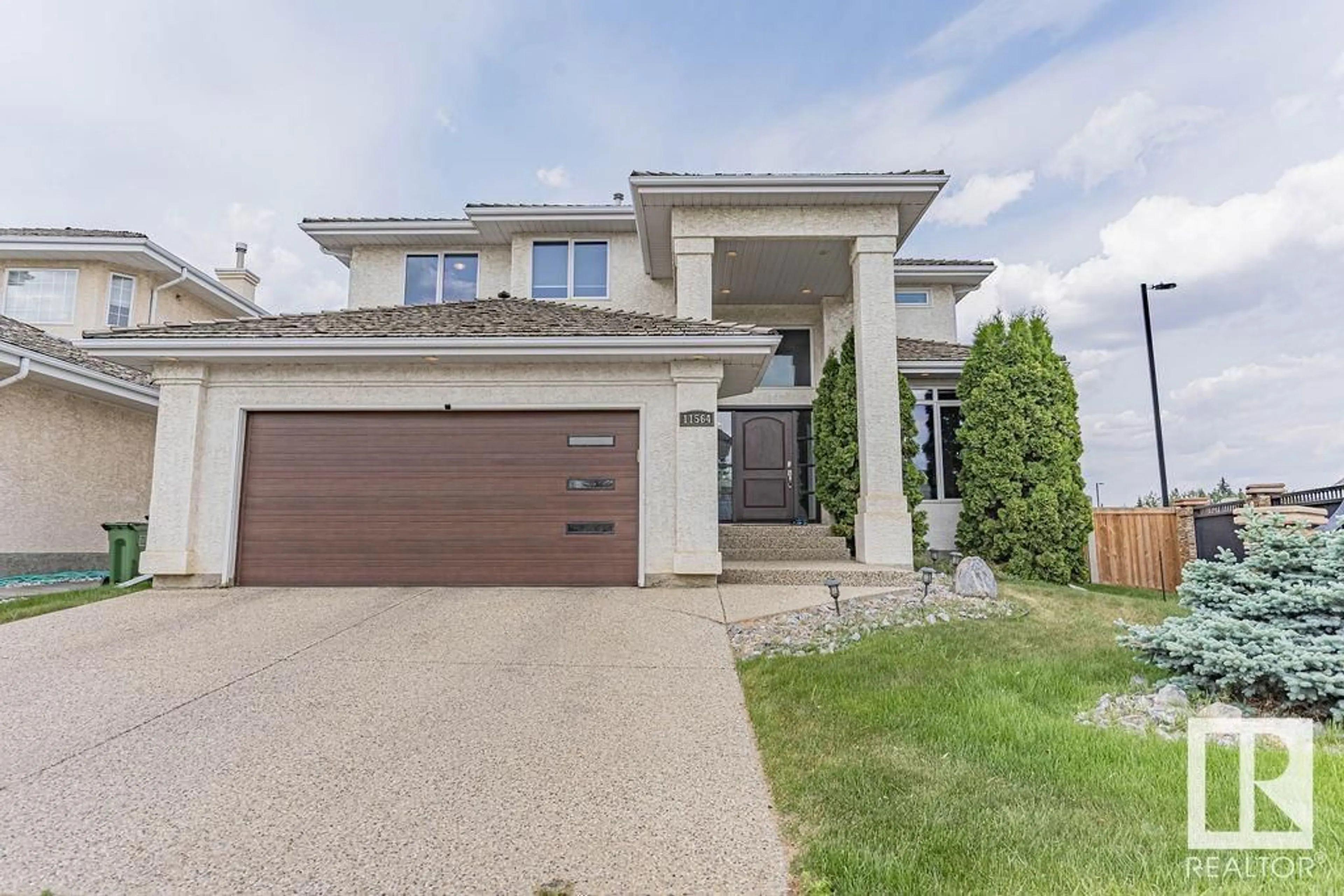 Home with brick exterior material, street for NW - 11564 15 AV, Edmonton Alberta T6J7C9
