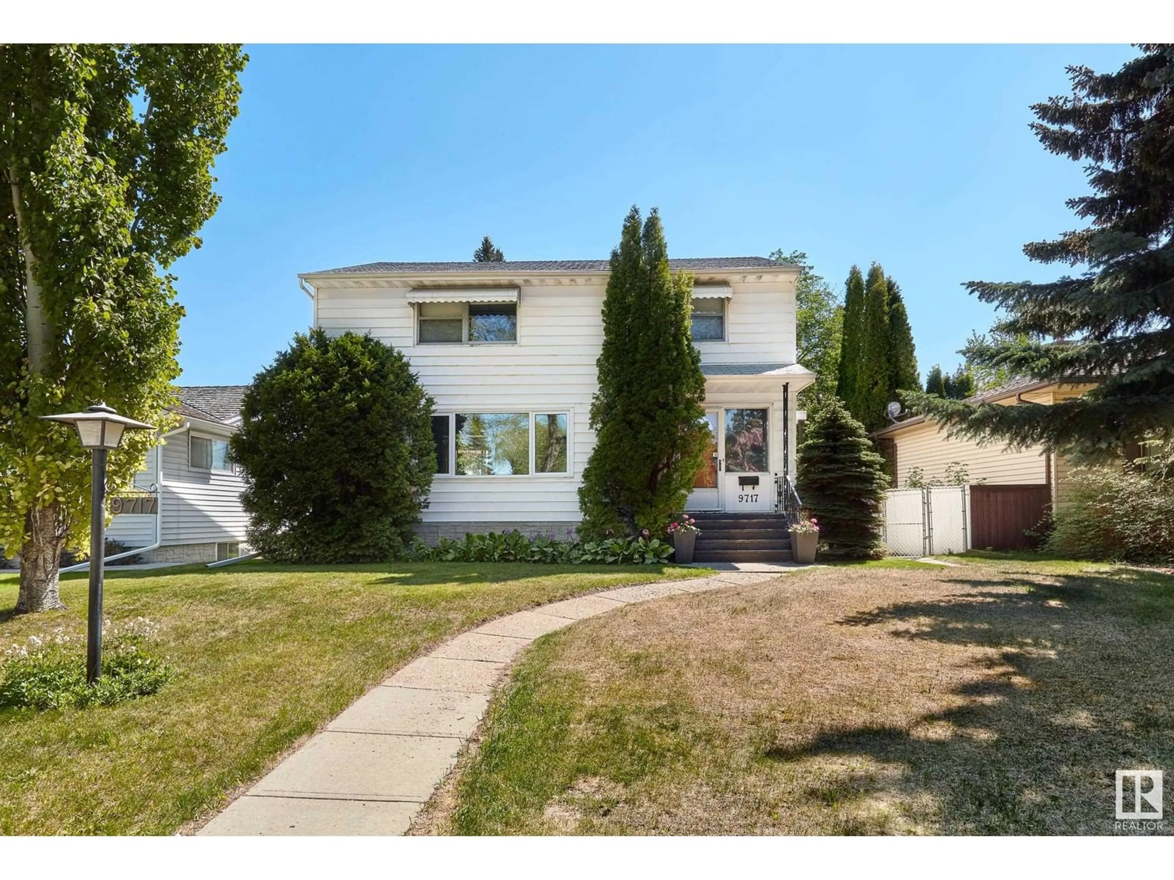 Home with vinyl exterior material, street for 9717 143 ST, Edmonton Alberta T5N2R3