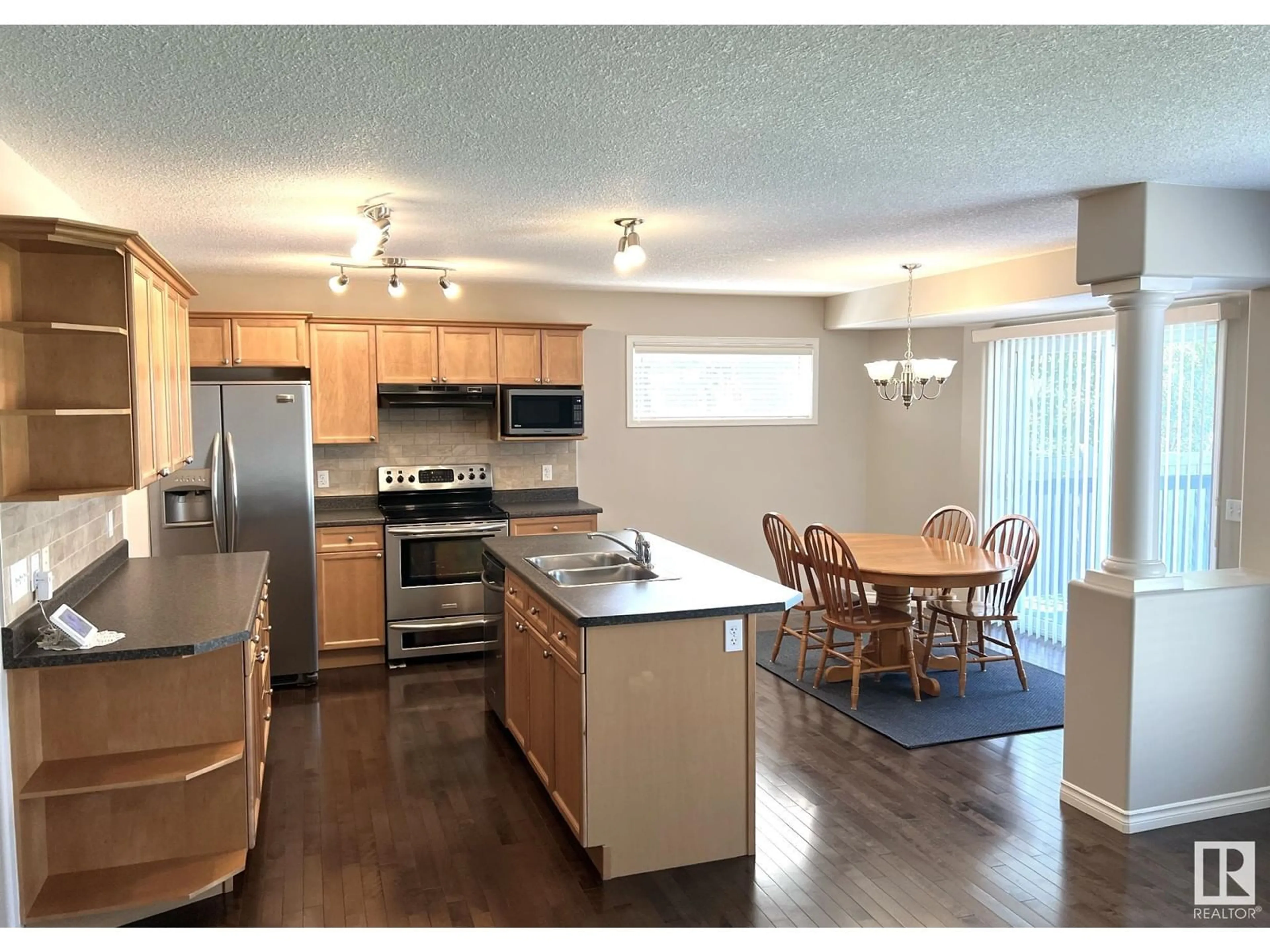 Open concept kitchen, wood/laminate floor for 612 60 ST, Edmonton Alberta T6X0G4