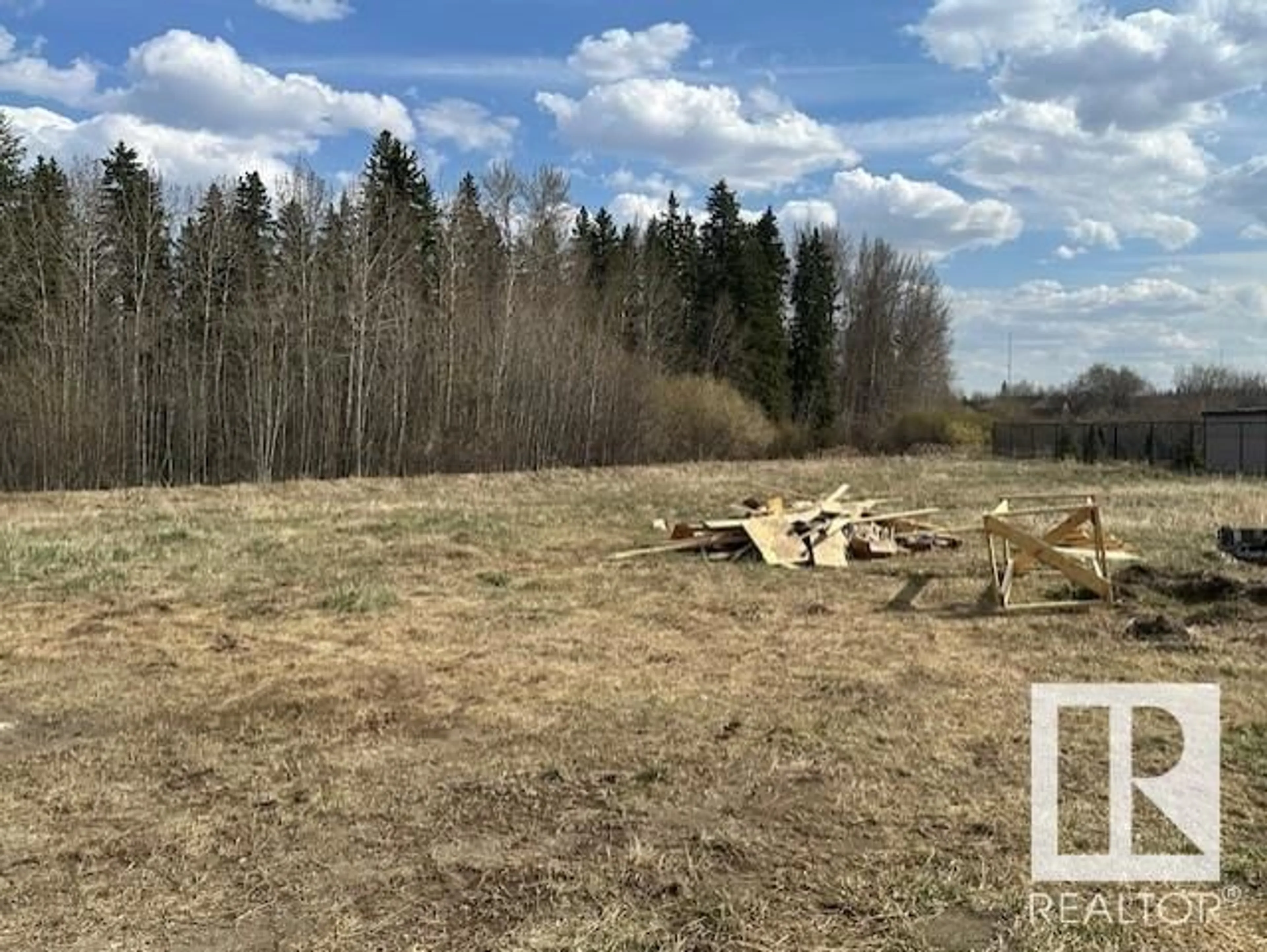 A pic from outside/outdoor area/front of a property/back of a property/a pic from drone, forest/trees view for 9 - 26409 TWP RD 532A, Rural Parkland County Alberta T7X3H5