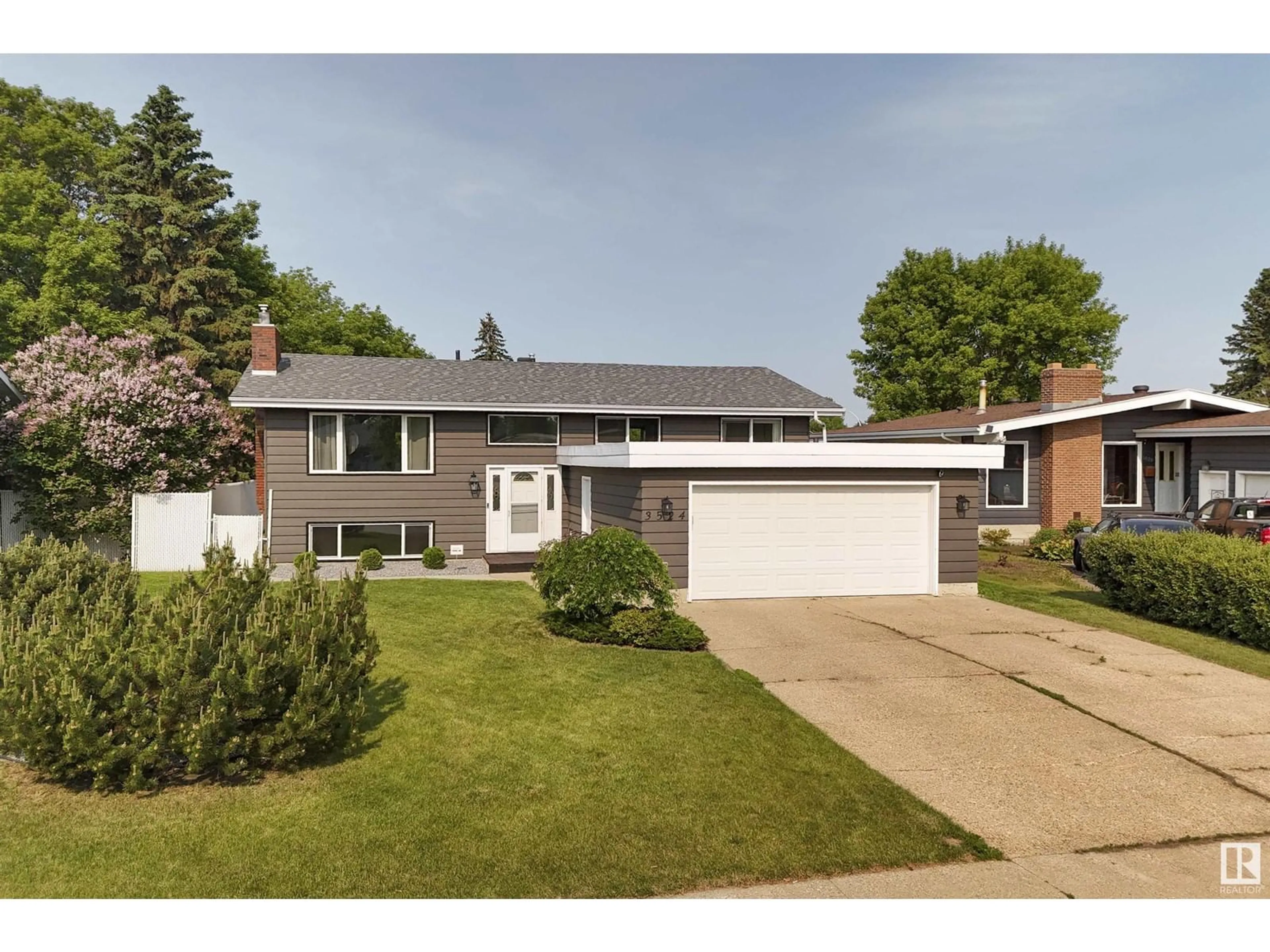 Home with vinyl exterior material, street for NW - 3524 104A ST, Edmonton Alberta T6J2N2