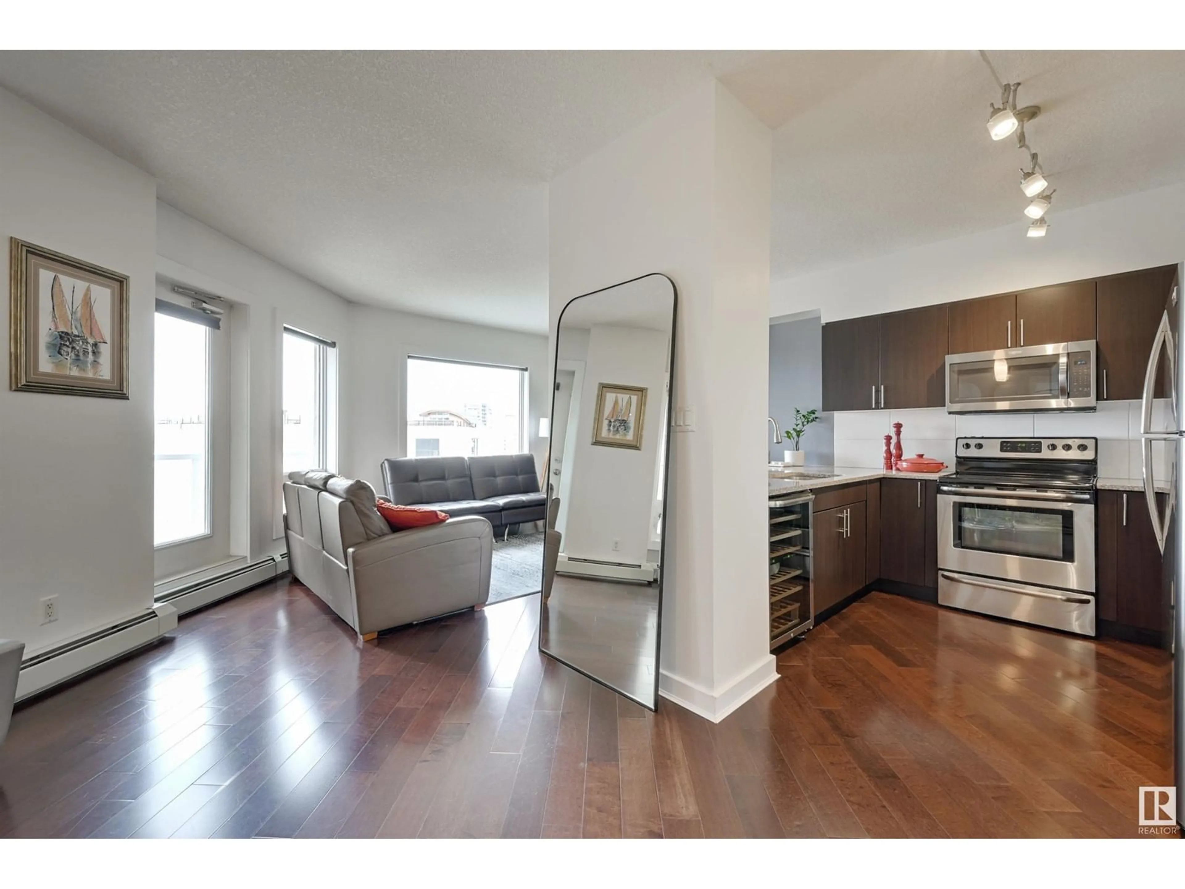 Open concept kitchen, wood/laminate floor for 1106 - 10152 104 ST NW, Edmonton Alberta T5J1A7