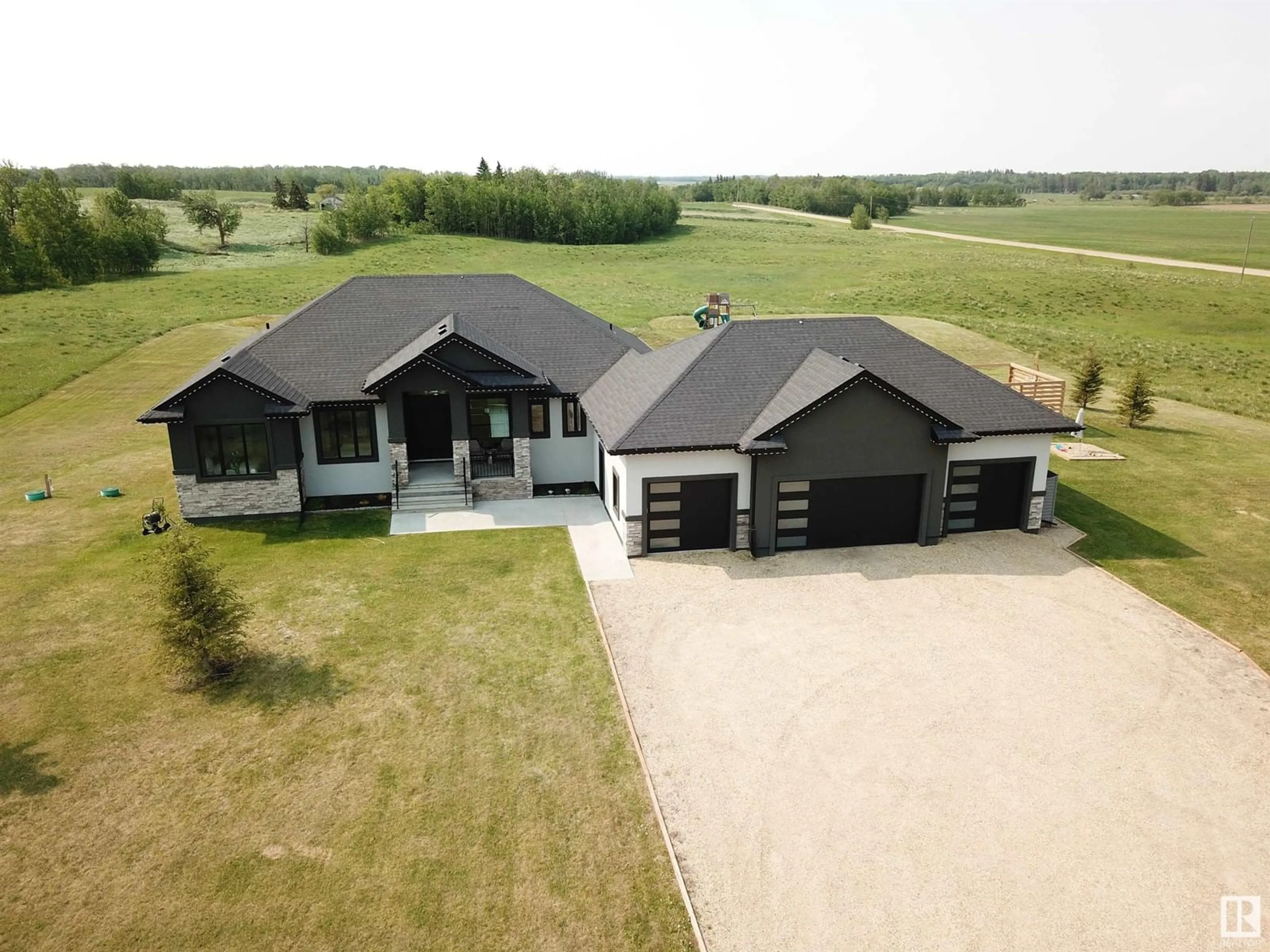 A pic from outside/outdoor area/front of a property/back of a property/a pic from drone, building for 540 50353 RG RD 224, Rural Leduc County Alberta T0B3M1