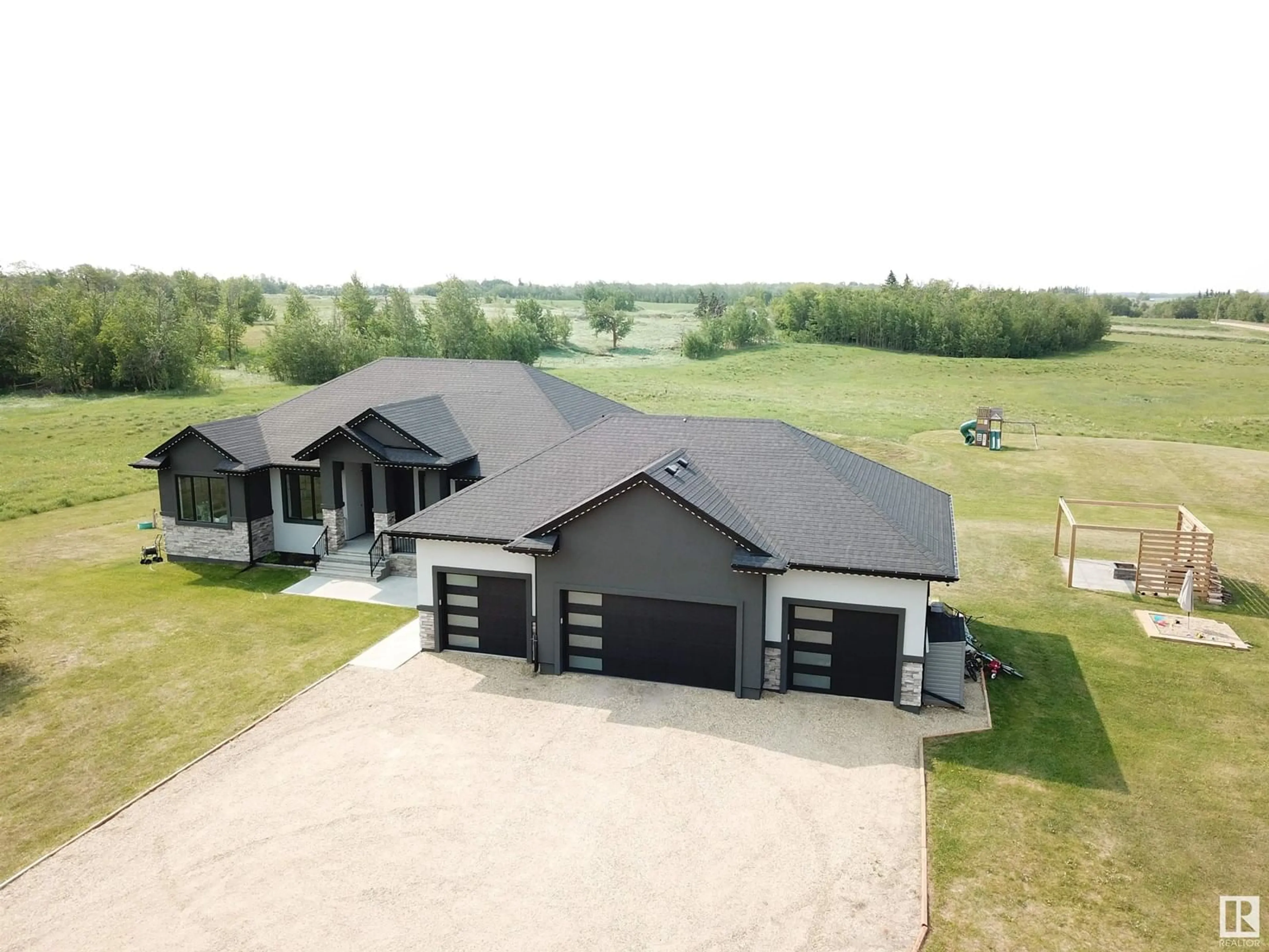 A pic from outside/outdoor area/front of a property/back of a property/a pic from drone, building for 540 50353 RG RD 224, Rural Leduc County Alberta T0B3M1