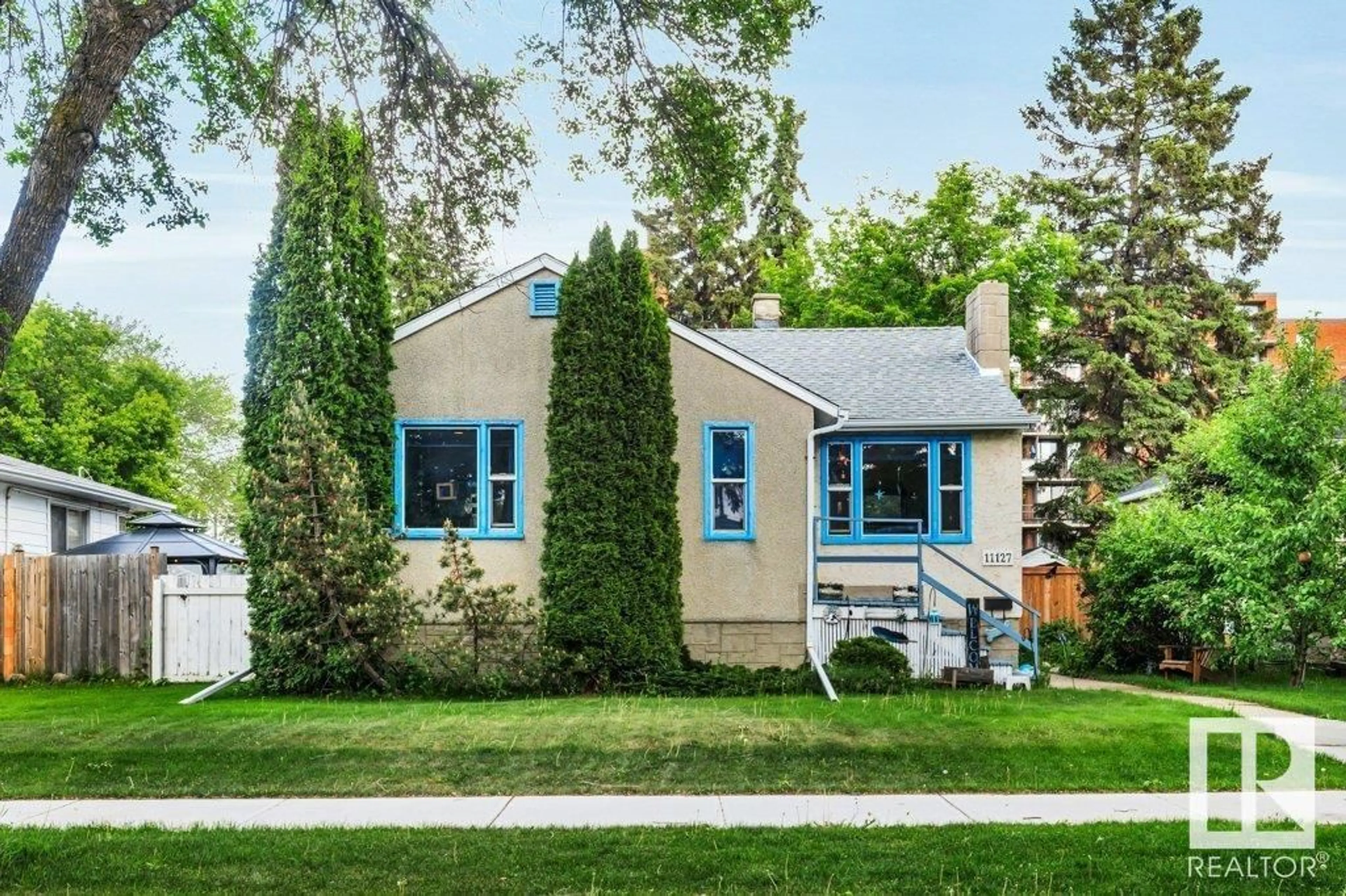 Home with vinyl exterior material, street for 11127 129 ST, Edmonton Alberta T5M0Y6