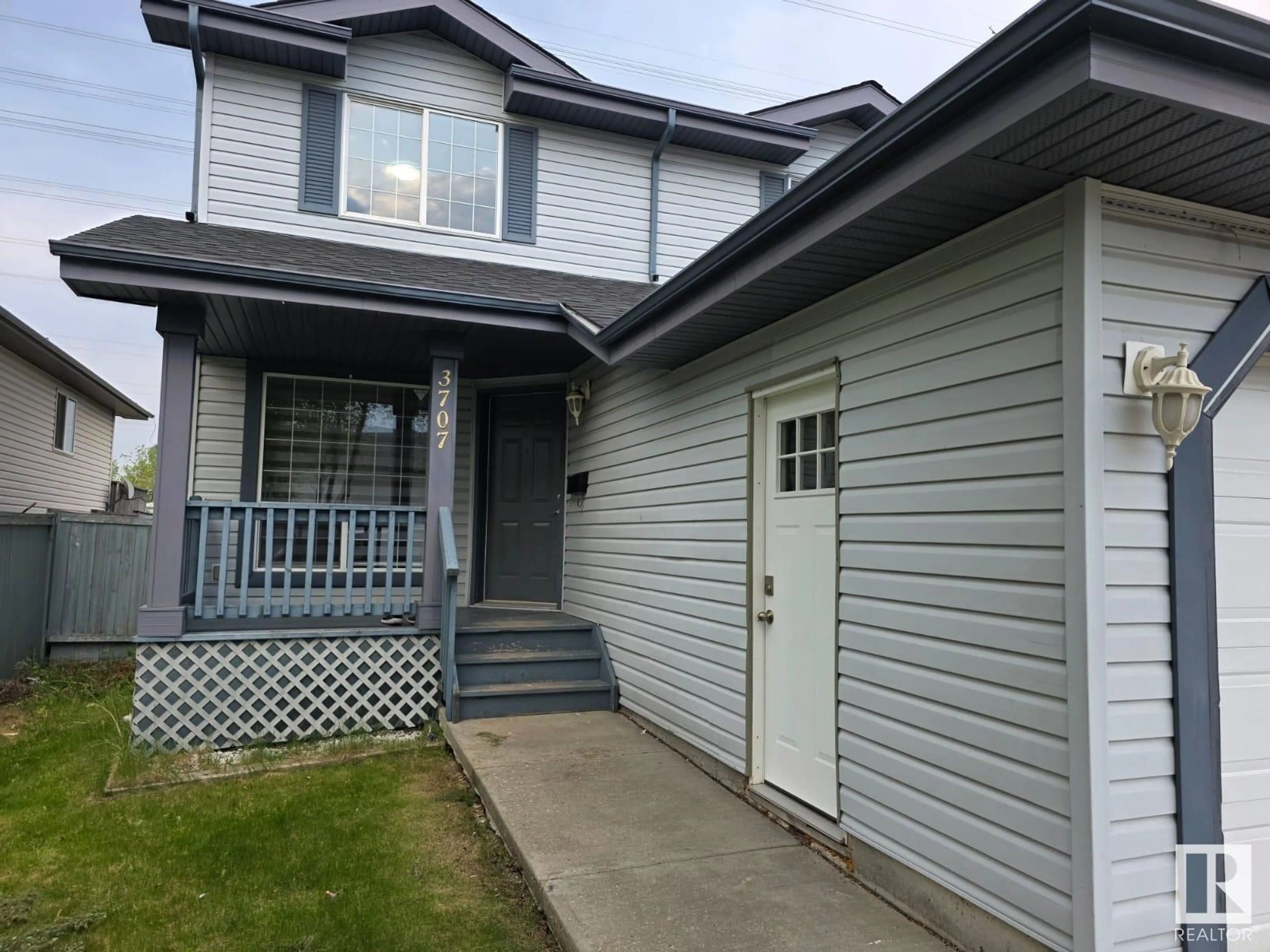 Home with vinyl exterior material, street for 3707 28 ST, Edmonton Alberta T6T1N3