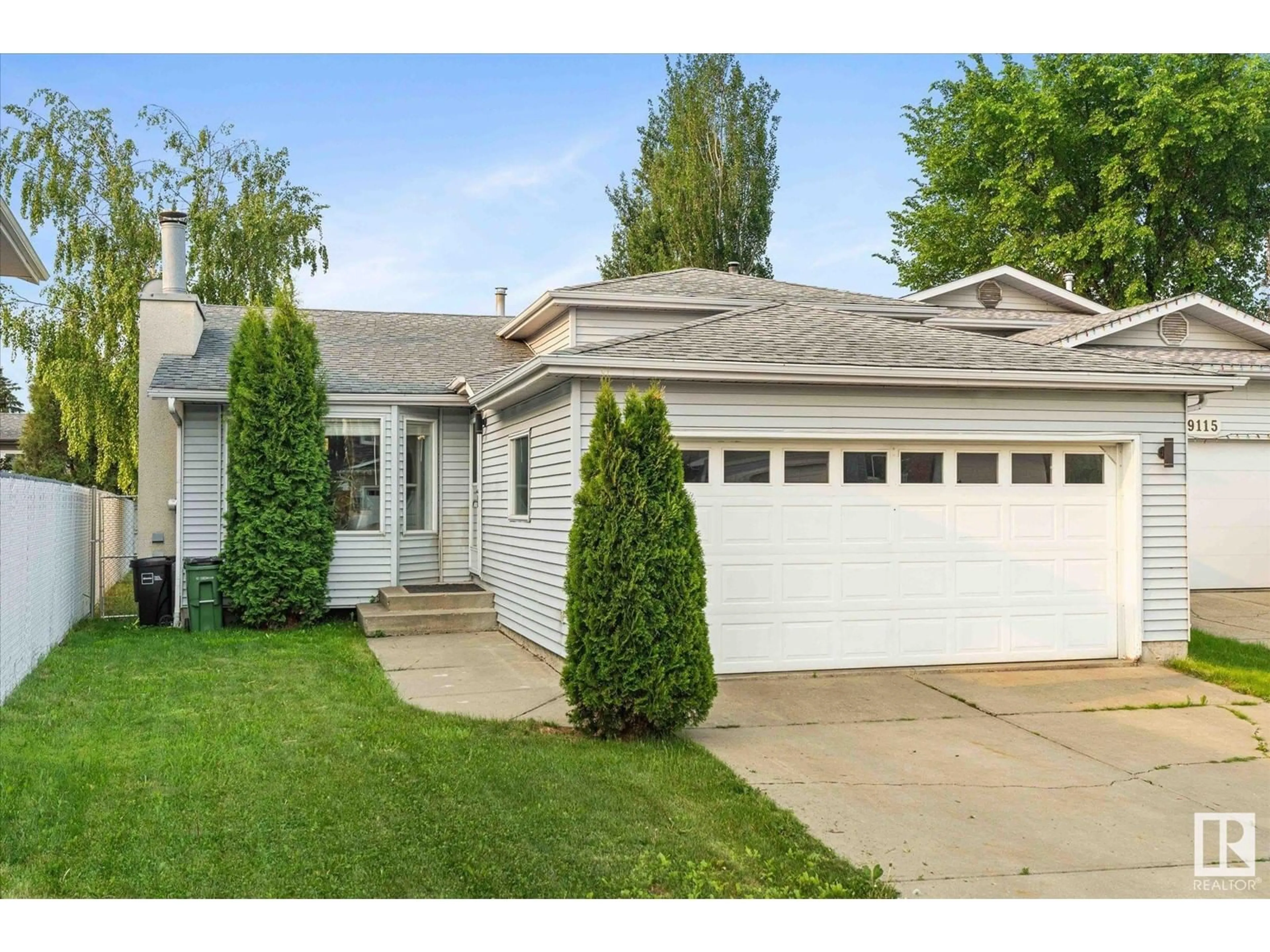 Home with vinyl exterior material, street for 9111 175A AV, Edmonton Alberta T5Z2M1