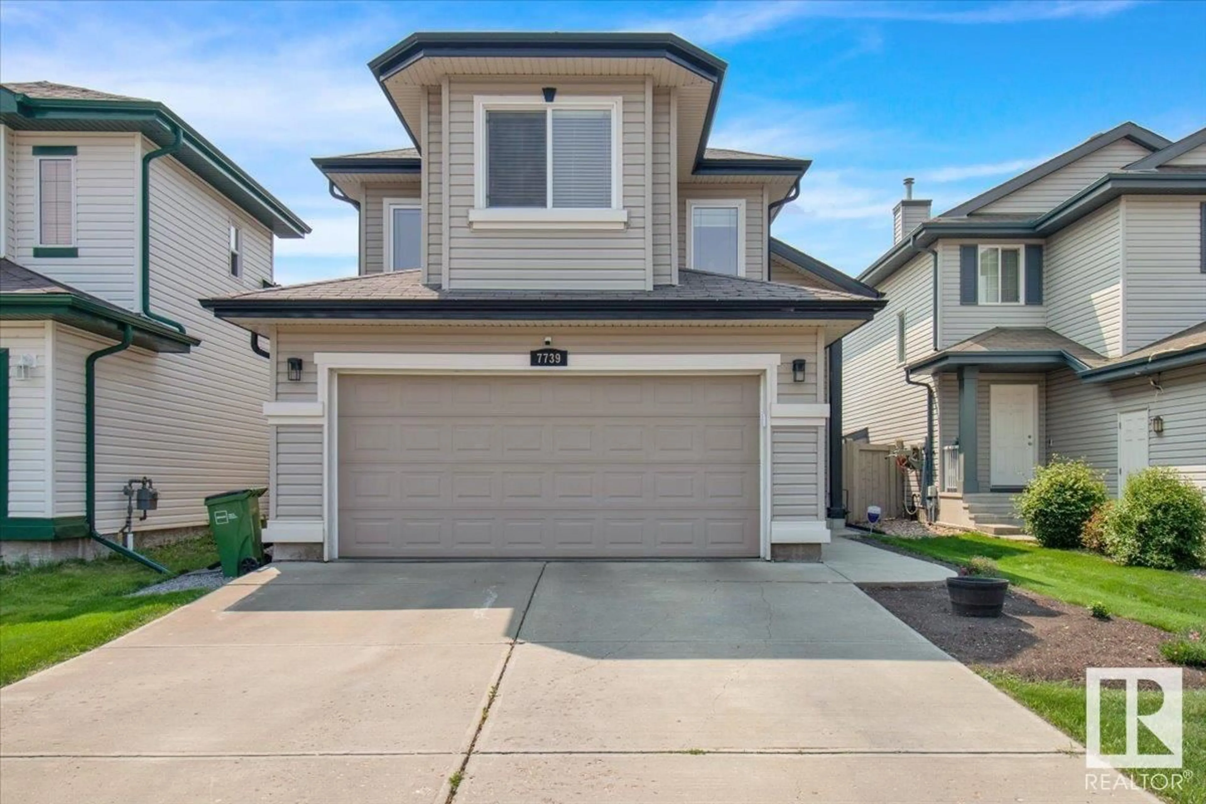 Home with vinyl exterior material, street for SW - 7739 7A AV, Edmonton Alberta T6X0A2
