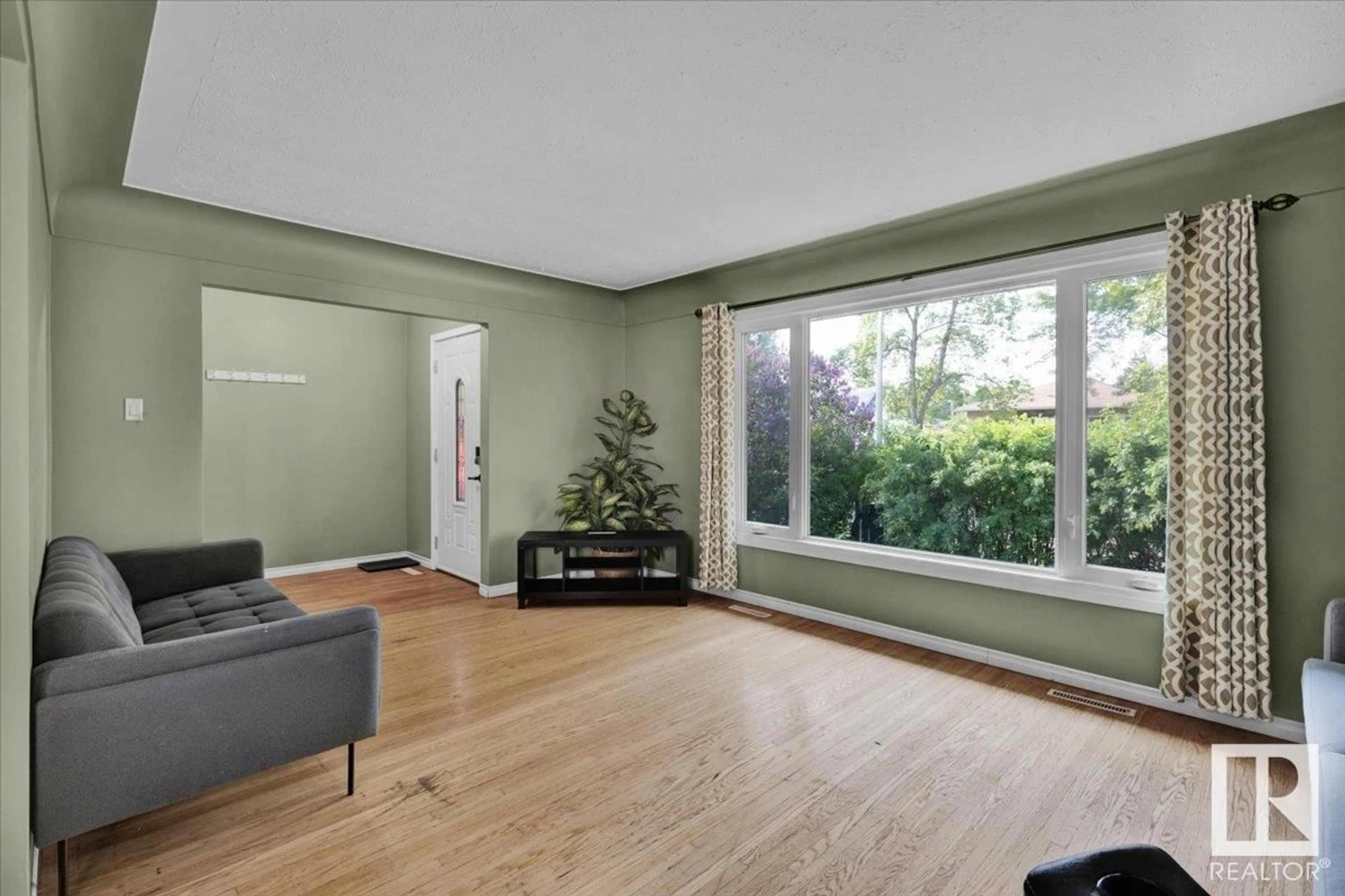 Living room with furniture, unknown for 10450 70 AV, Edmonton Alberta T6H2E8