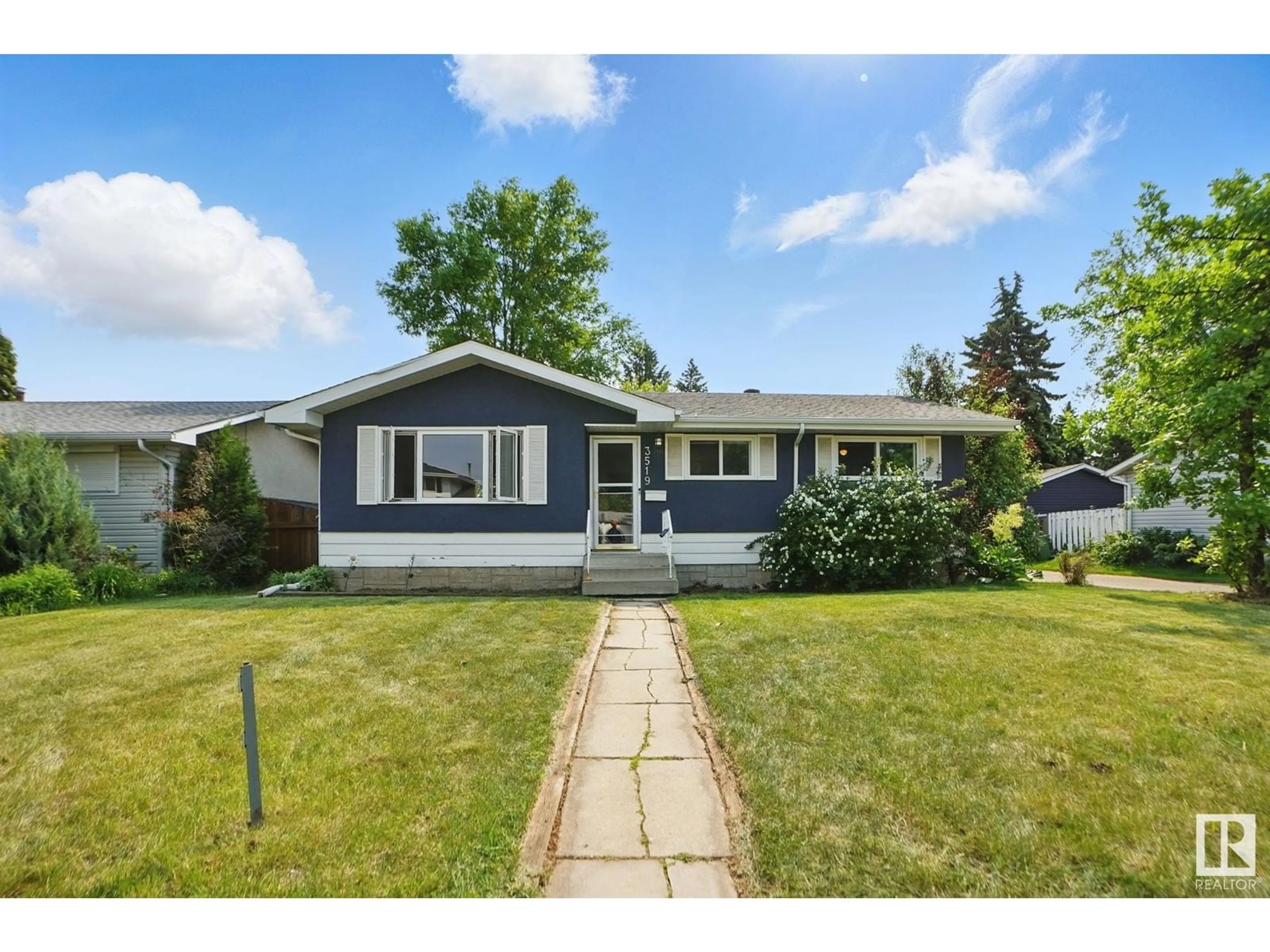 Home with vinyl exterior material, street for 3519 109 ST, Edmonton Alberta T6J1C2