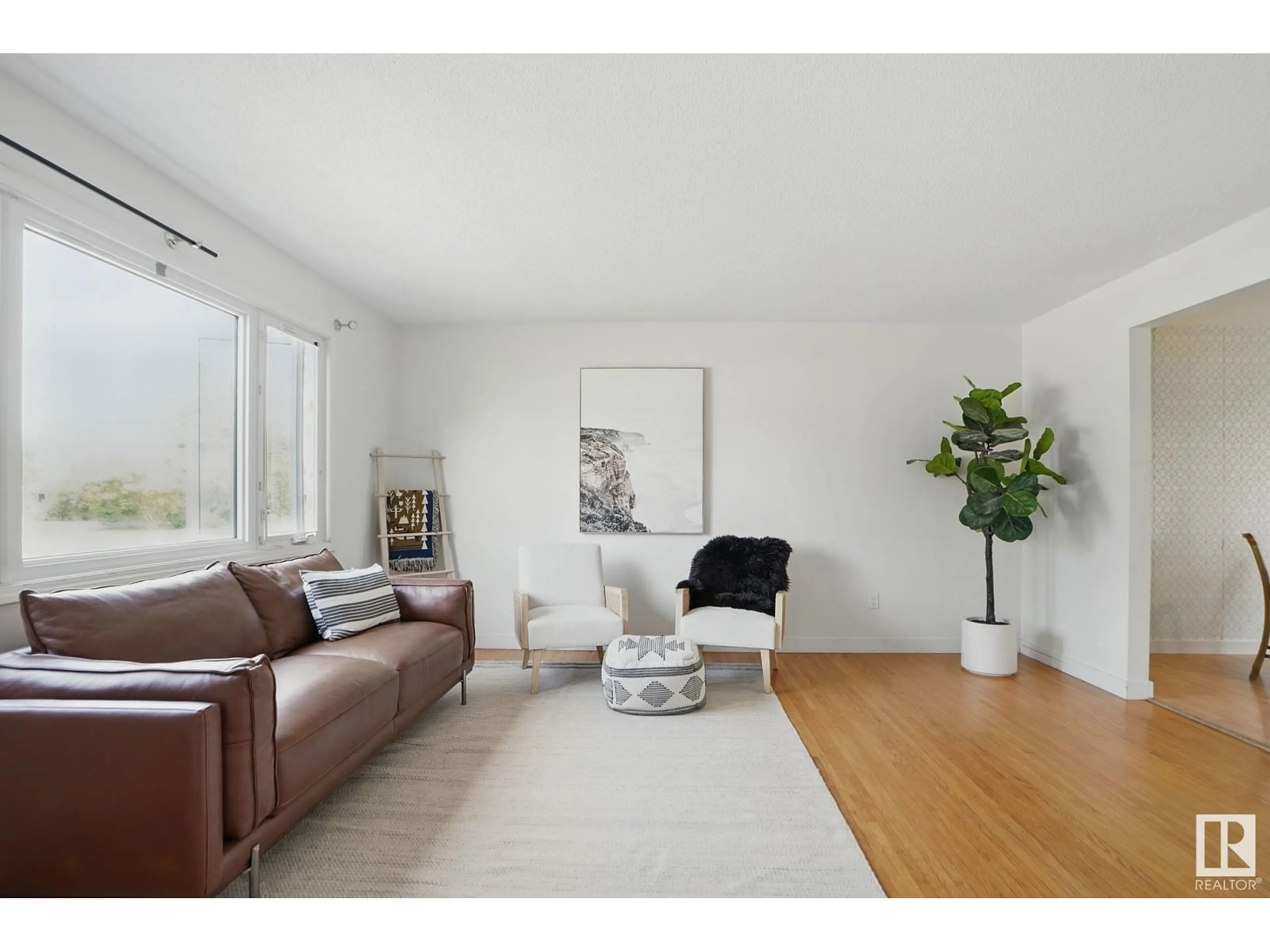 Living room with furniture, wood/laminate floor for 3519 109 ST, Edmonton Alberta T6J1C2