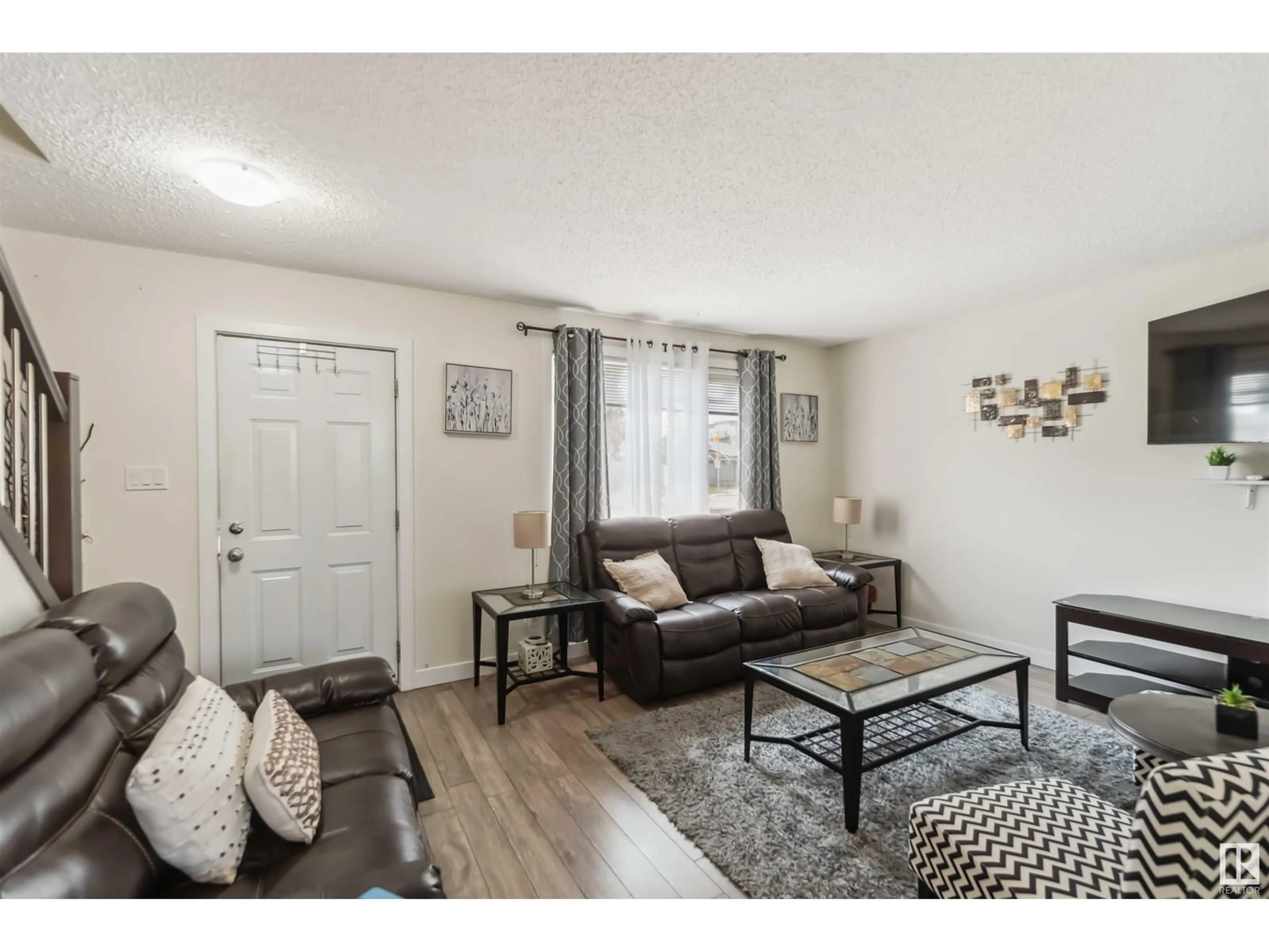 Living room with furniture, wood/laminate floor for 308 HERMITAGE RD, Edmonton Alberta T5A2S3