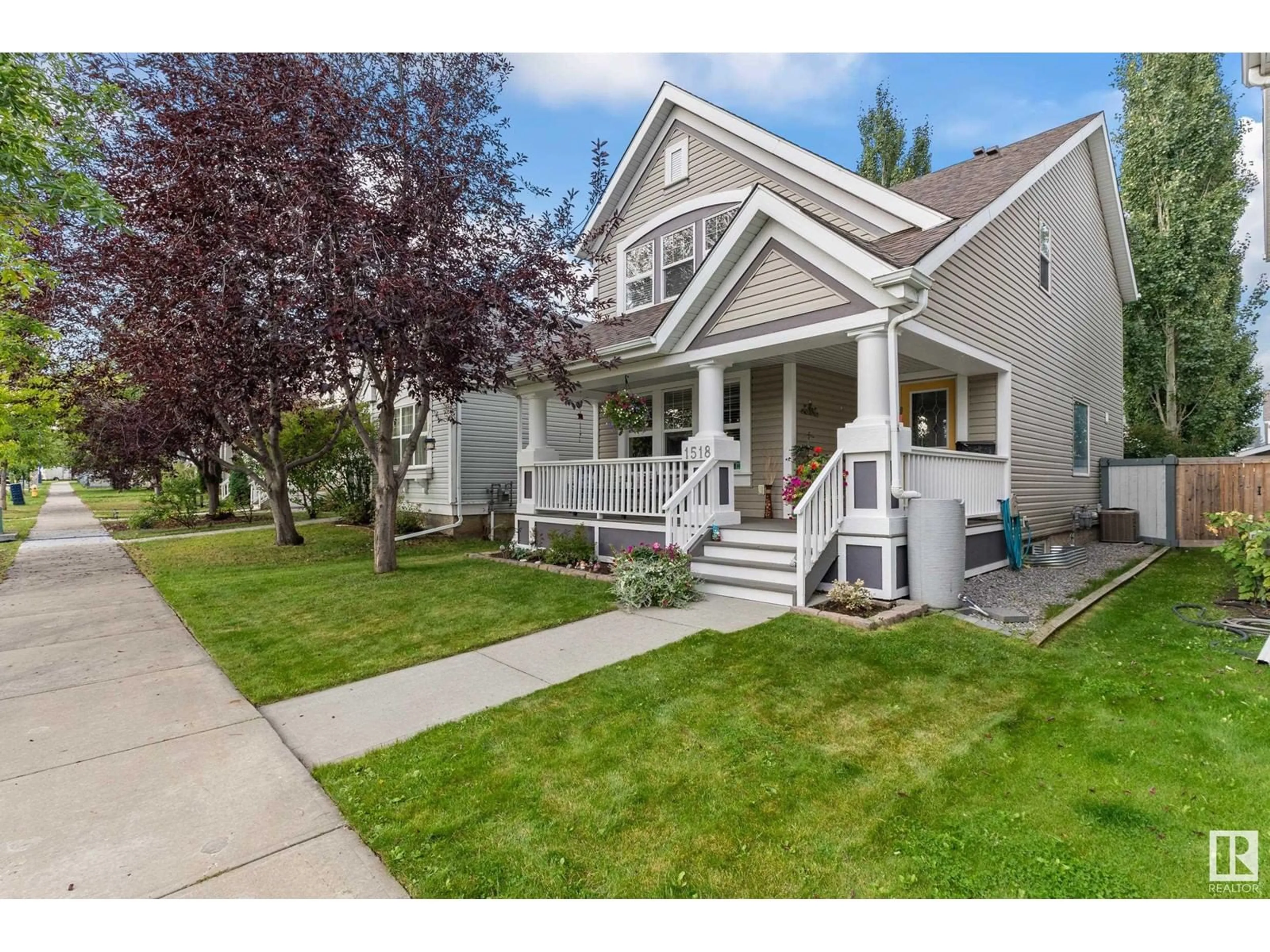 Home with vinyl exterior material, street for 1518 76 ST, Edmonton Alberta T6X1M3
