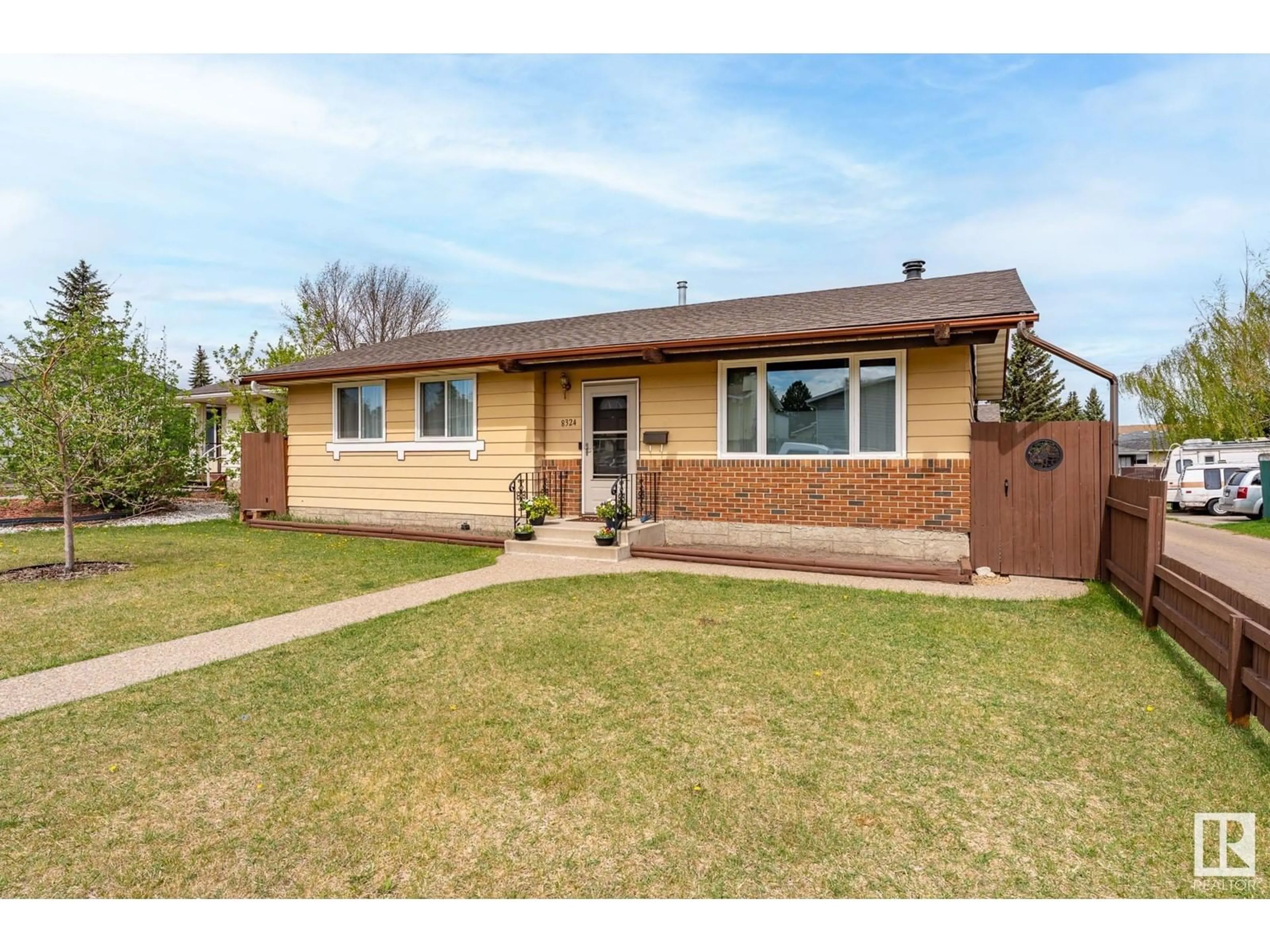 Home with brick exterior material, street for 8324 19 AV, Edmonton Alberta T6K2E1