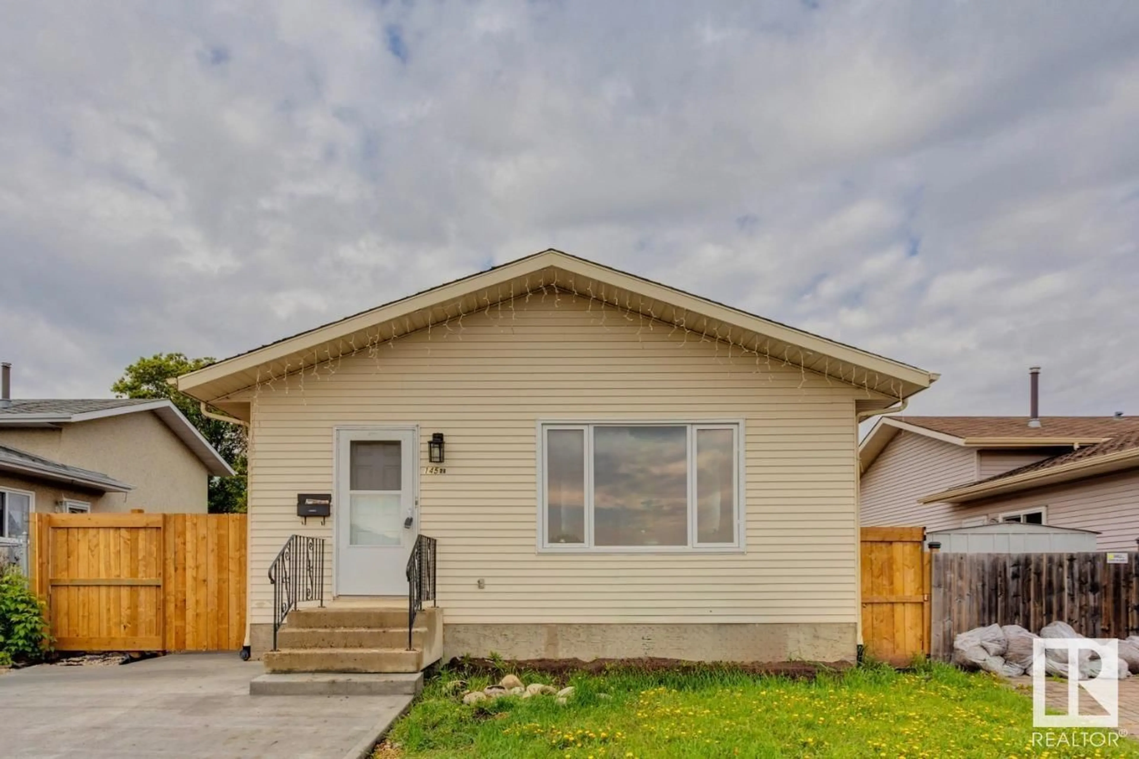 Home with vinyl exterior material, street for NW - 14528 34 ST, Edmonton Alberta T5Y2J2