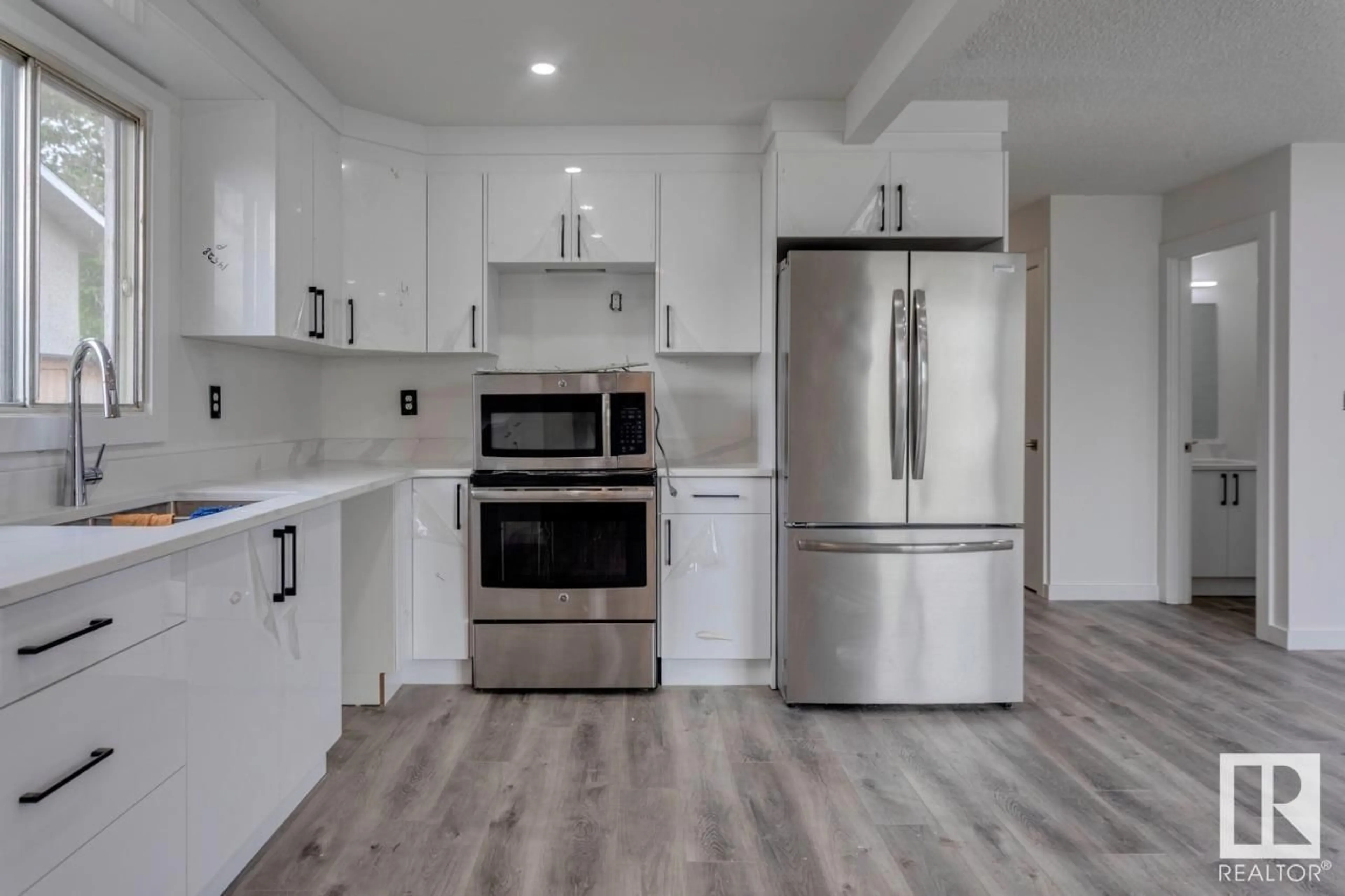 Open concept kitchen, unknown for NW - 14528 34 ST, Edmonton Alberta T5Y2J2