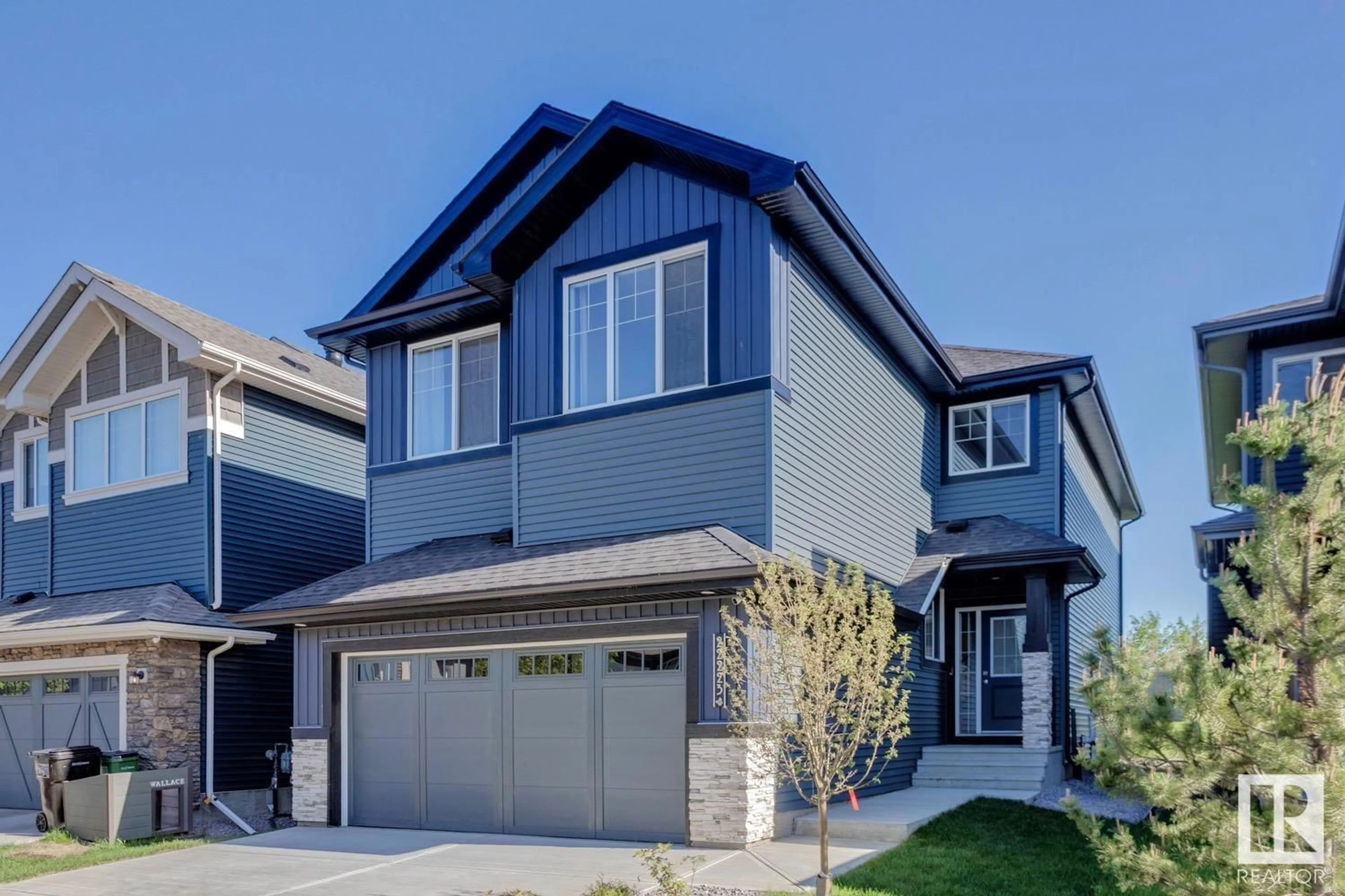 Home with vinyl exterior material, street for NW - 22223 80 AV, Edmonton Alberta T5T7H9