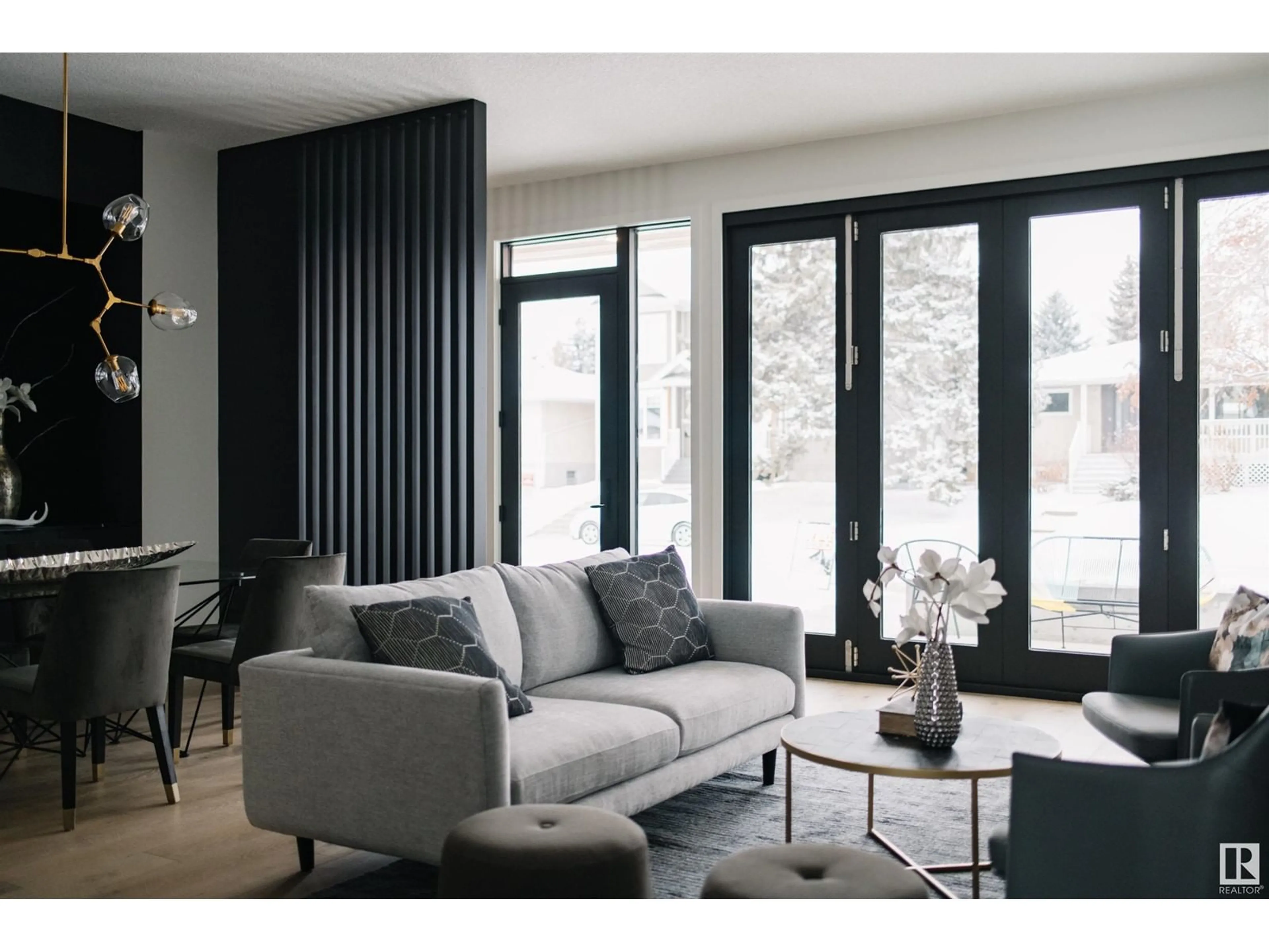 Living room with furniture, wood/laminate floor for 10519 75 ST, Edmonton Alberta T6A2Z6