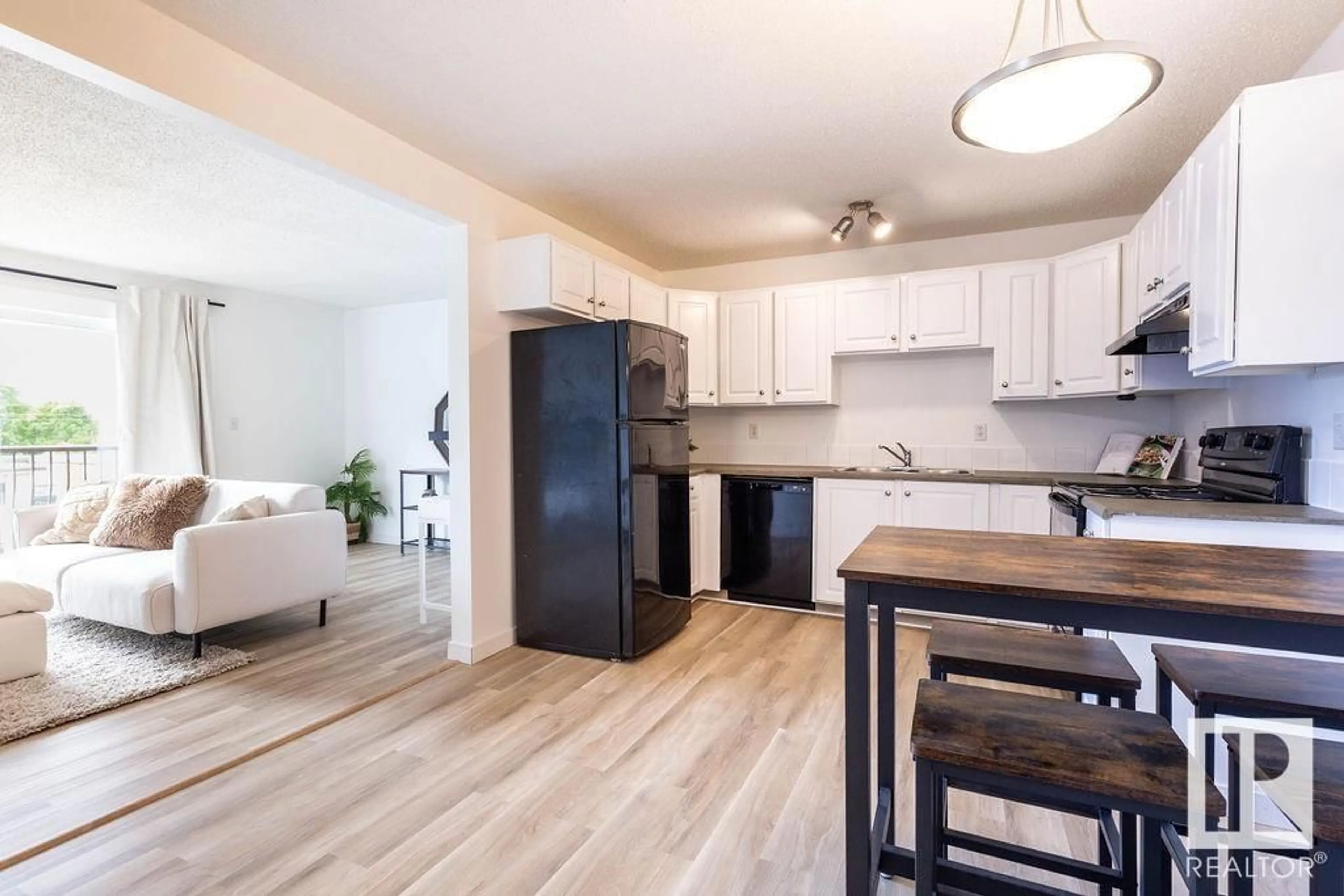 Open concept kitchen, wood/laminate floor for #52 - 10208 113 ST NW, Edmonton Alberta T5K1P4