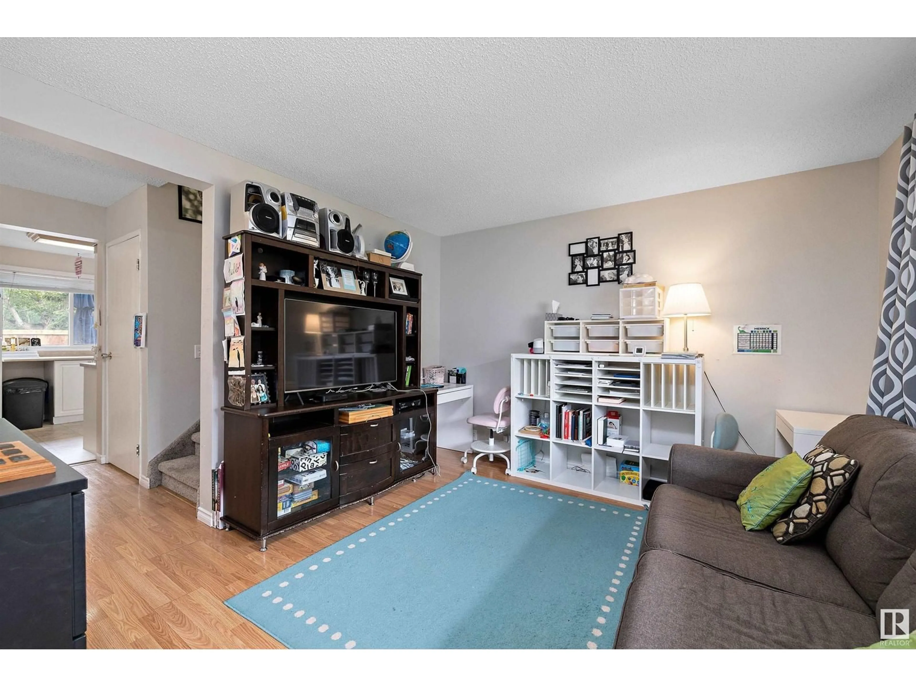 Living room with furniture, wood/laminate floor for 749 VILLAGE DR, Sherwood Park Alberta T8A4H9