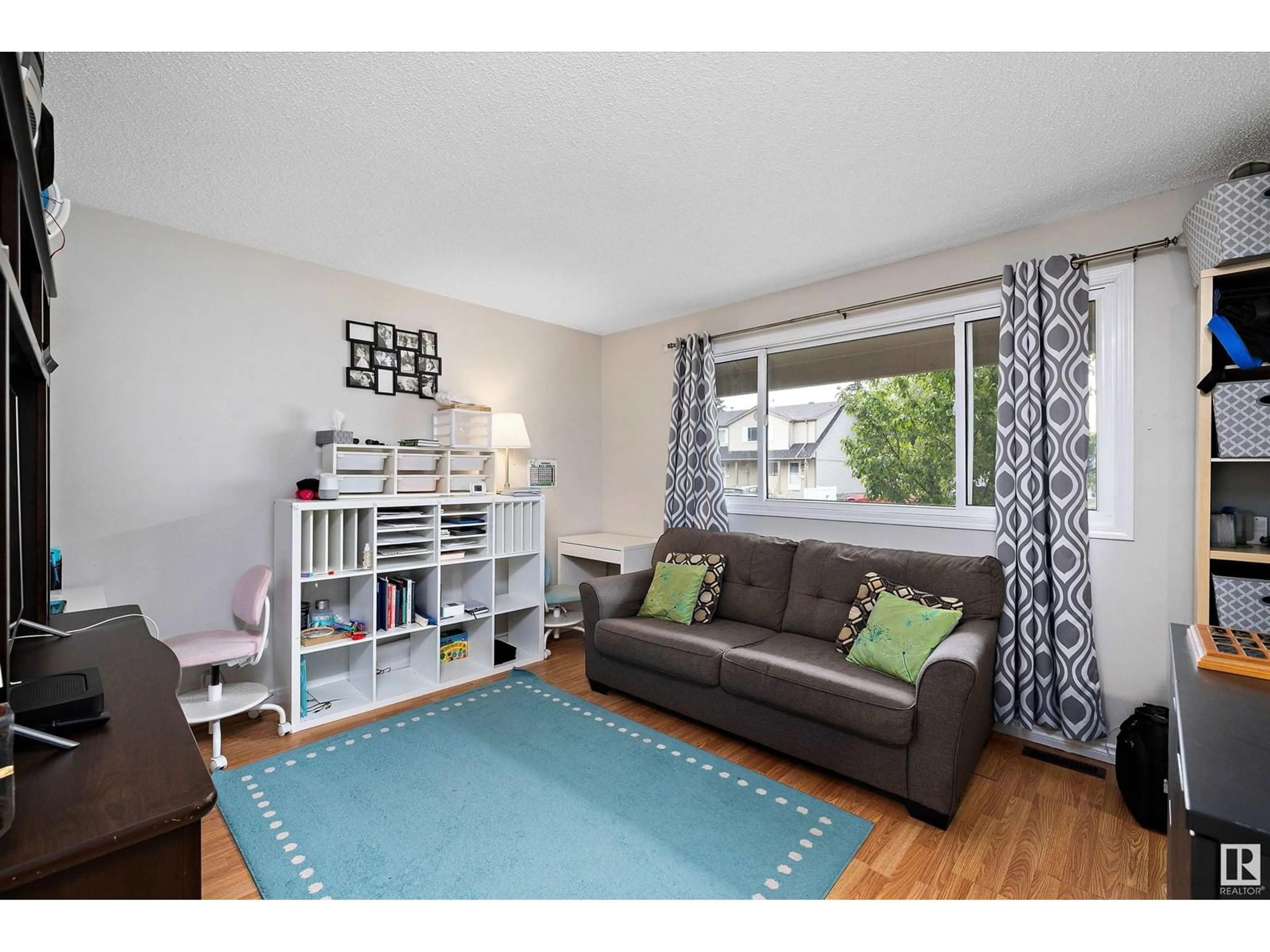 Living room with furniture, wood/laminate floor for 749 VILLAGE DR, Sherwood Park Alberta T8A4H9