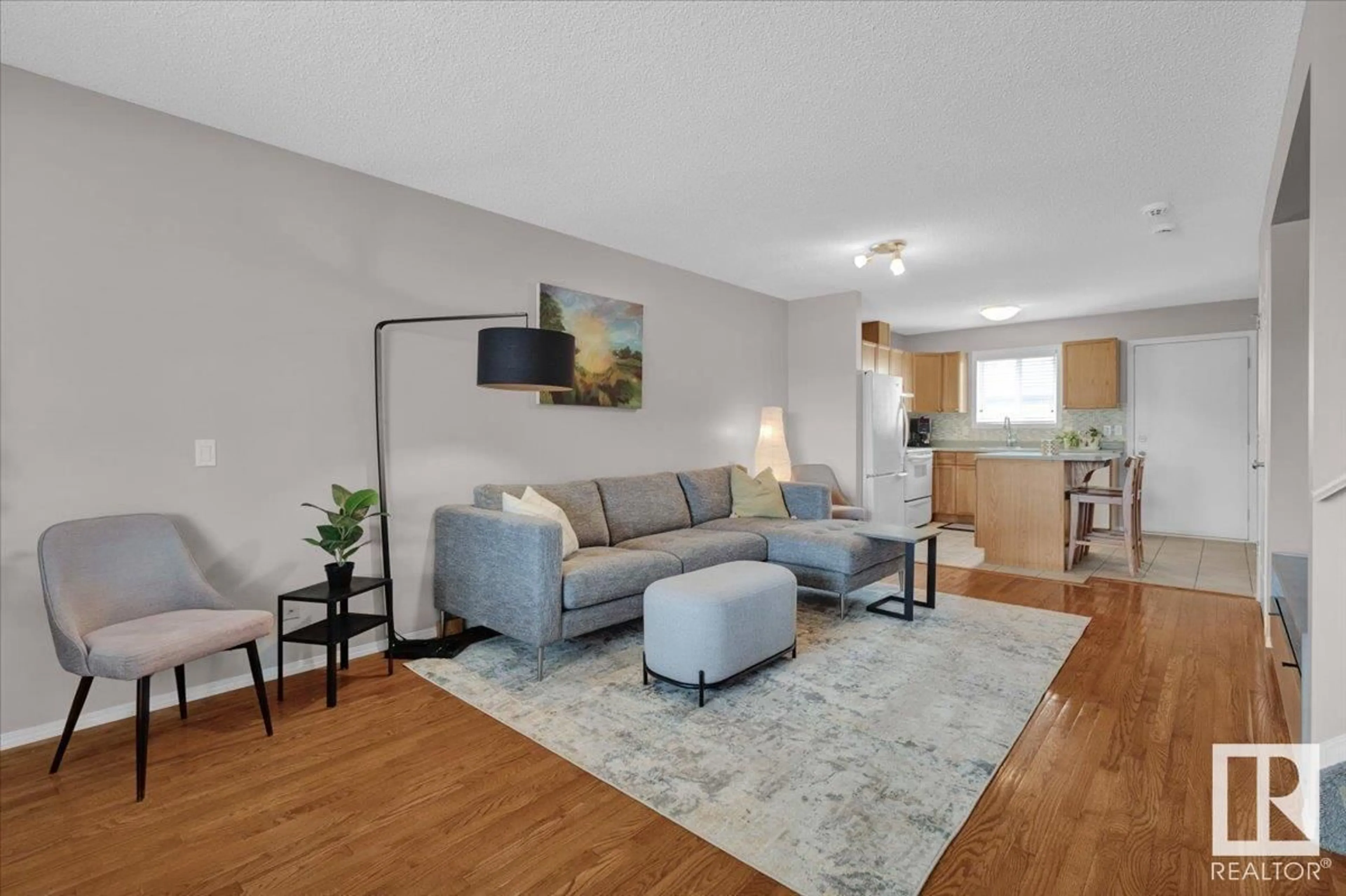 Living room with furniture, wood/laminate floor for 77 - 10909 106 ST NW, Edmonton Alberta T5H4M7
