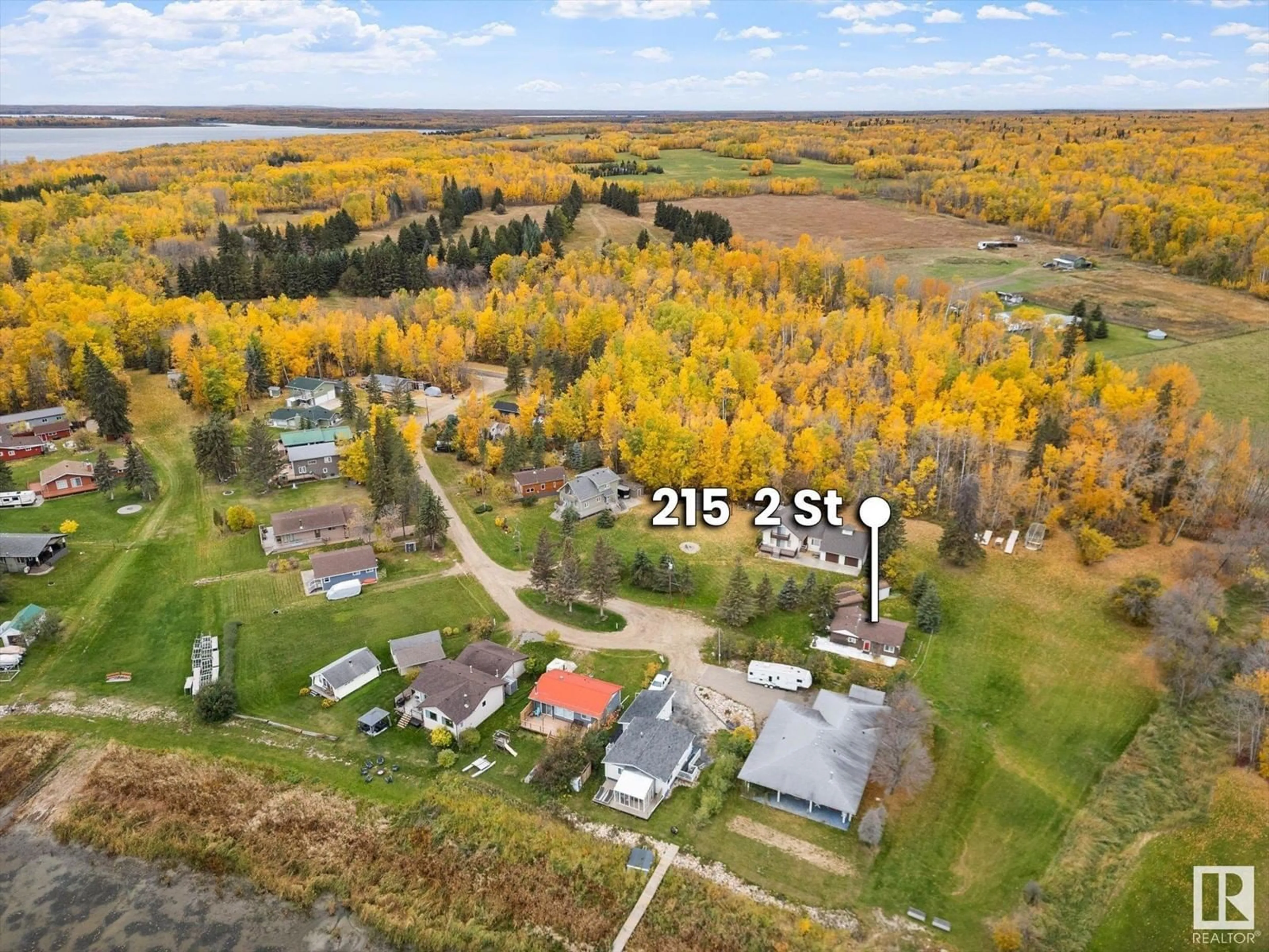 A pic from outside/outdoor area/front of a property/back of a property/a pic from drone, water/lake/river/ocean view for 215 2ND STREET, Rural Lac Ste. Anne County Alberta T0E1A0