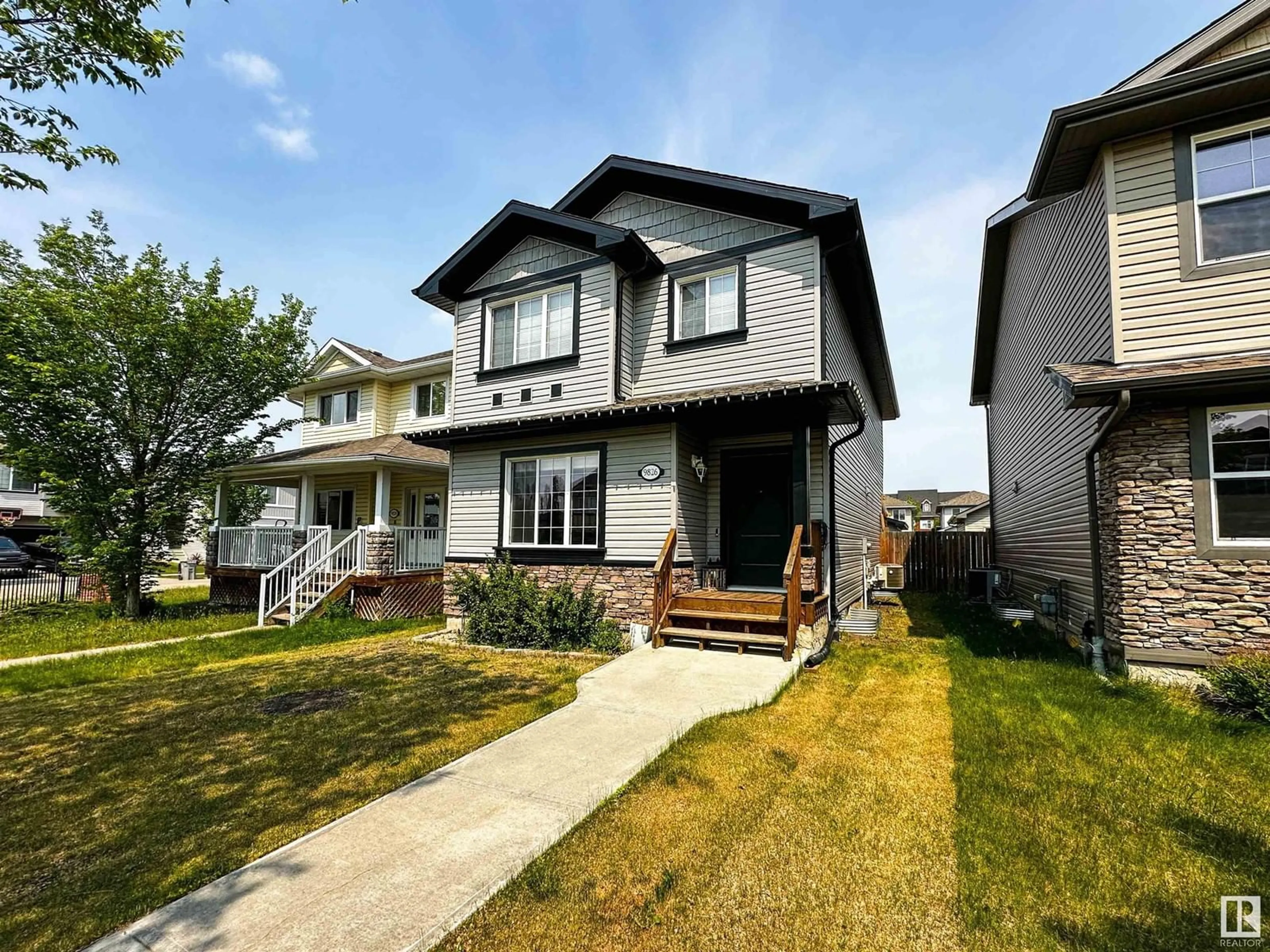 Home with vinyl exterior material, street for 9826 103 AV, Morinville Alberta T8R0C2