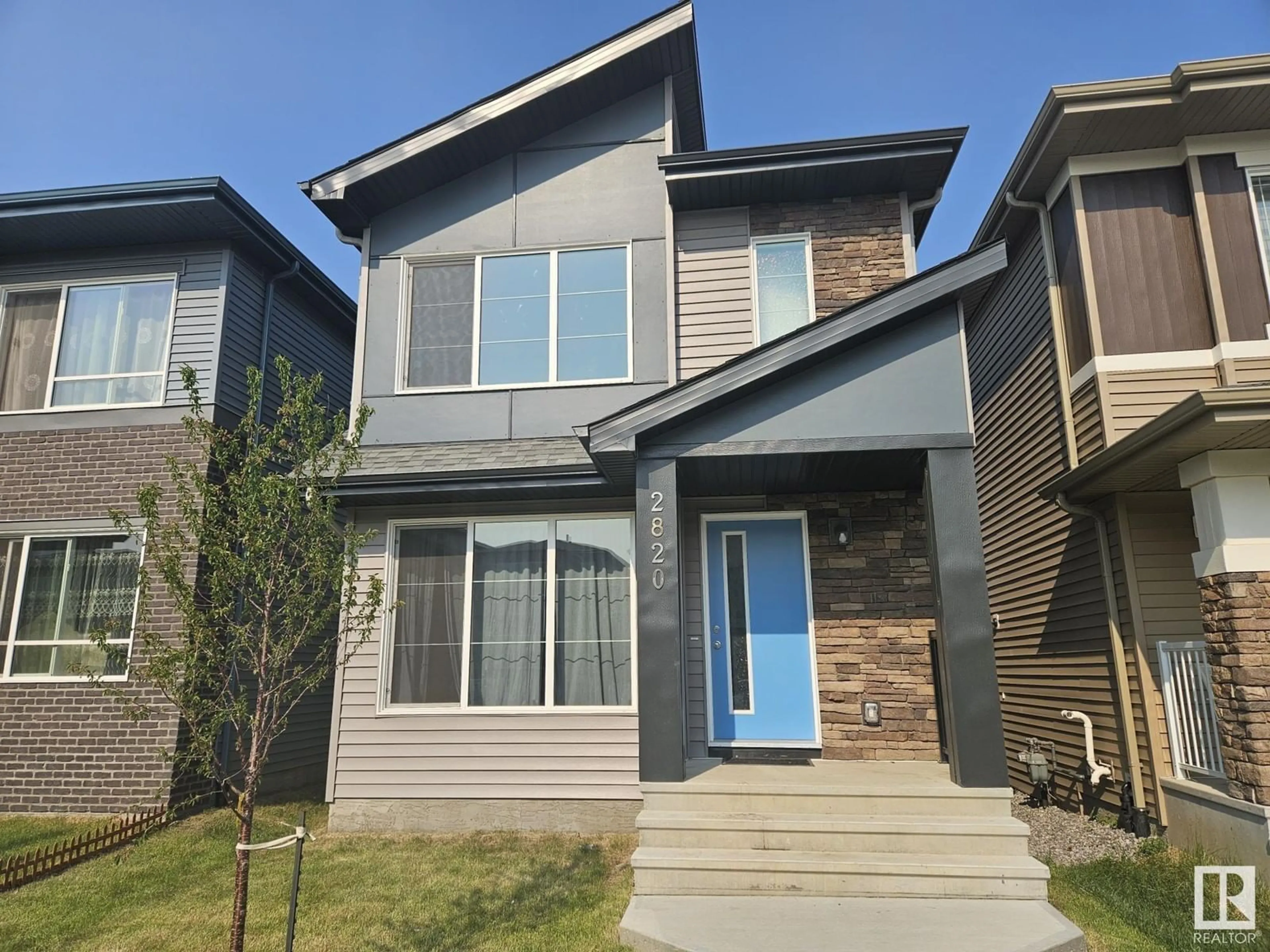 Home with vinyl exterior material, street for NW - 2820 193 ST, Edmonton Alberta T6M3B2