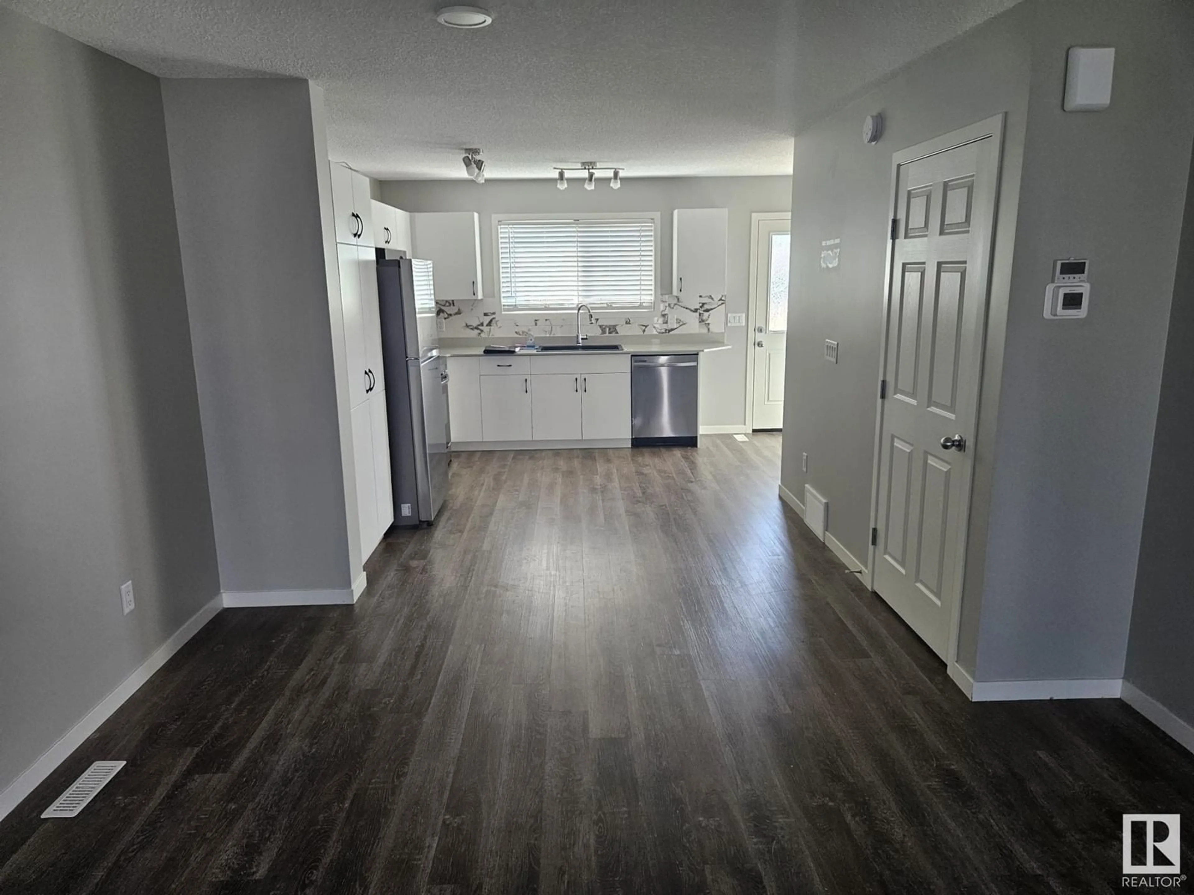 Open concept kitchen, wood/laminate floor for NW - 2820 193 ST, Edmonton Alberta T6M3B2