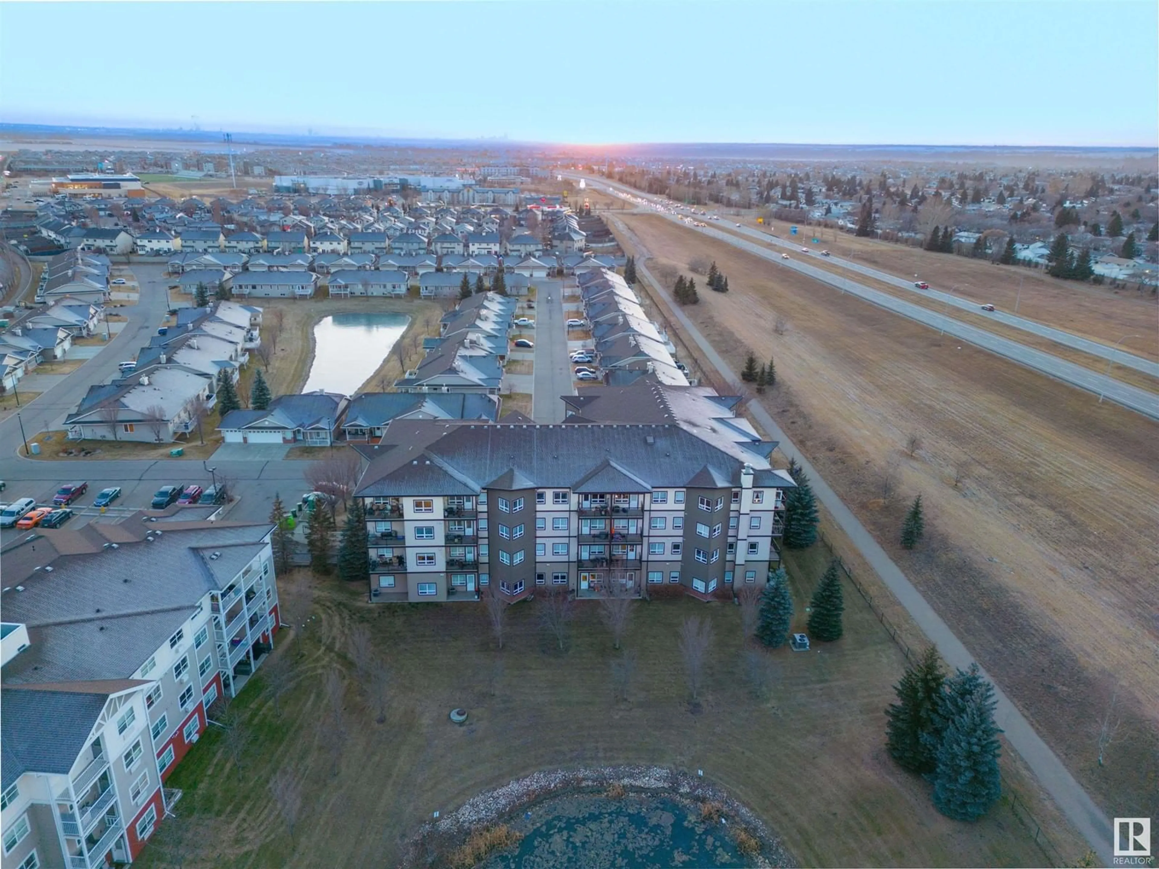 A pic from outside/outdoor area/front of a property/back of a property/a pic from drone, mountain view for #406 - 8702 SOUTHFORT DR, Fort Saskatchewan Alberta T8L4R6