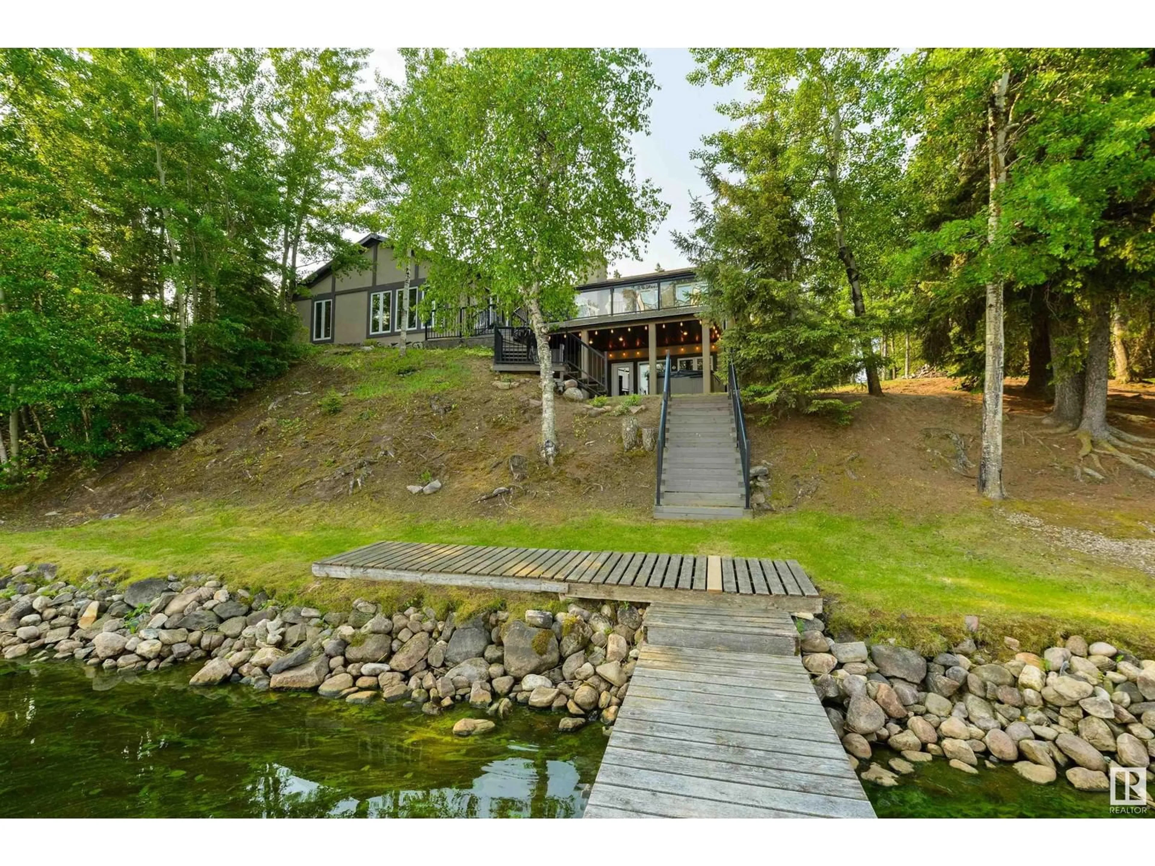 A pic from outside/outdoor area/front of a property/back of a property/a pic from drone, water/lake/river/ocean view for 18 TWP ROAD 565 TWP ROAD, Rural Lac Ste. Anne County Alberta T0E1V0