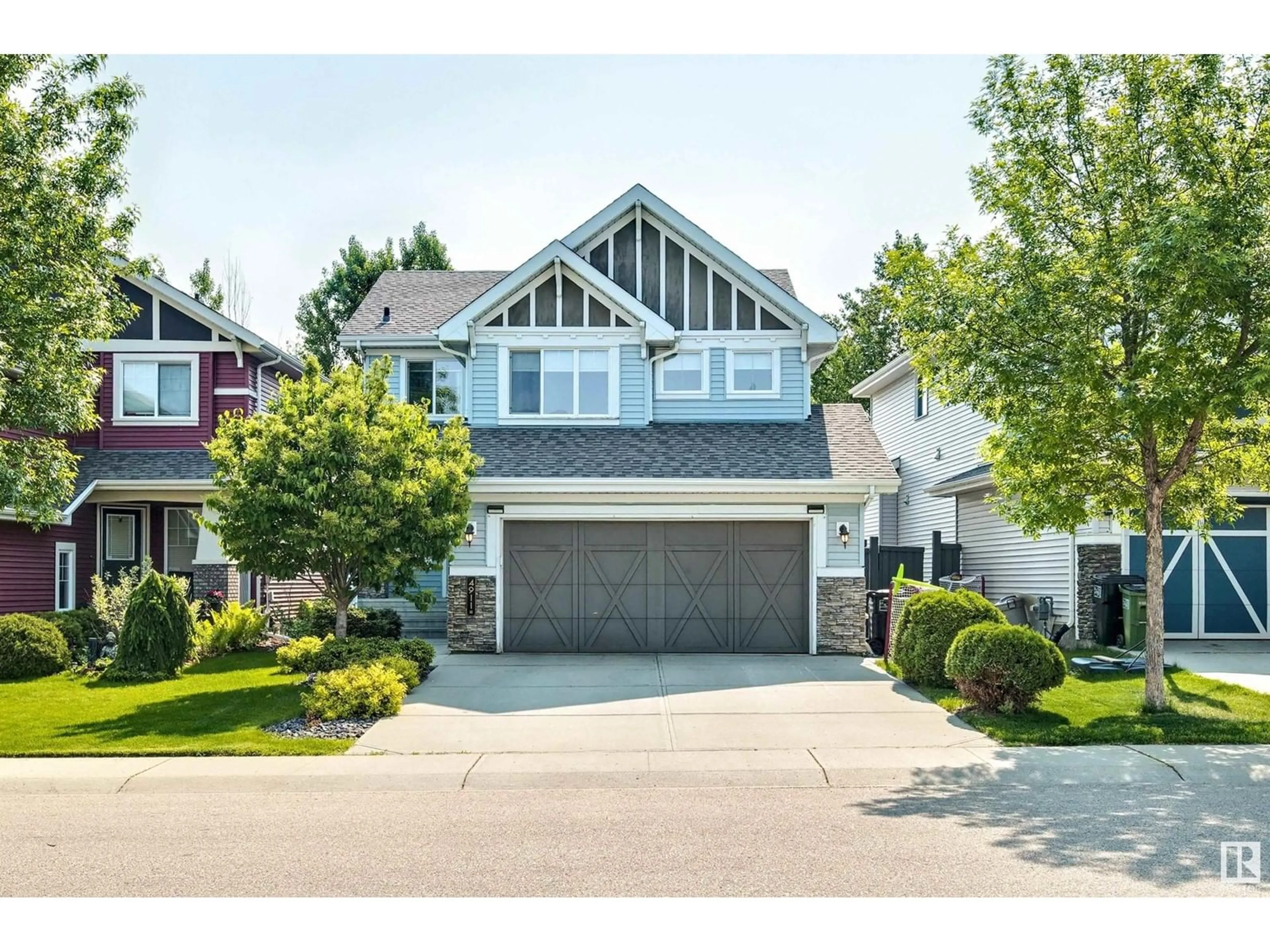 Home with vinyl exterior material, street for 4911 213 ST, Edmonton Alberta T6M0G6