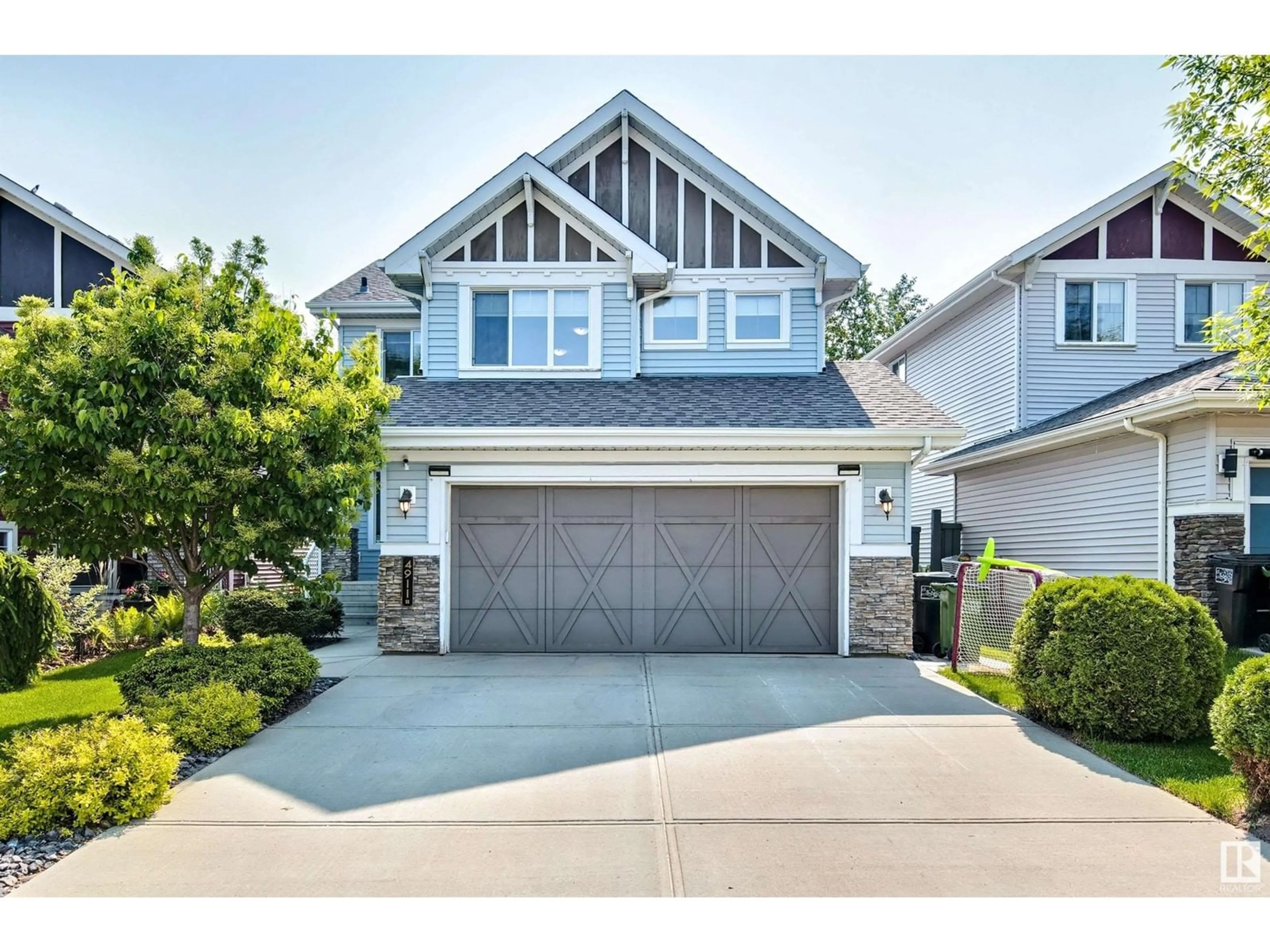 Home with vinyl exterior material, street for 4911 213 ST, Edmonton Alberta T6M0G6