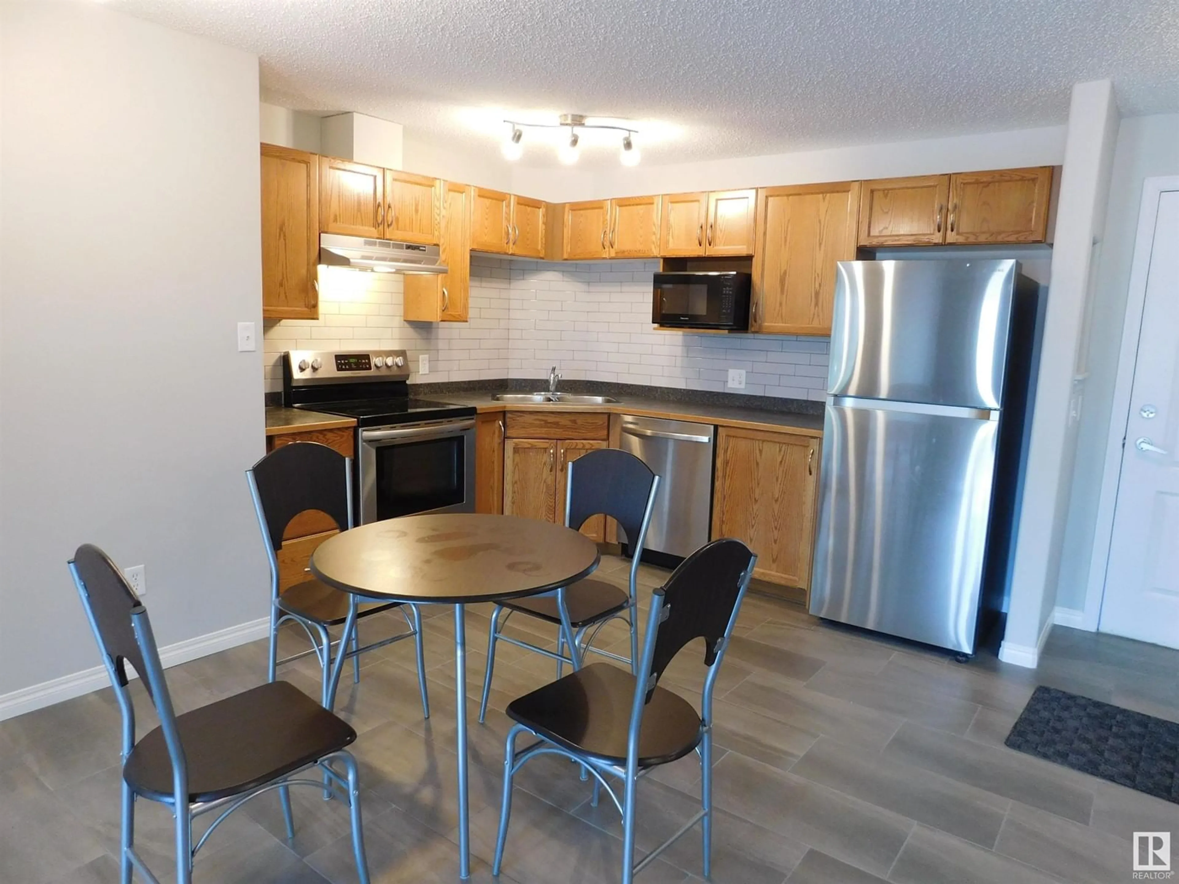 Standard kitchen, wood/laminate floor for 225 - 5340 199 ST NW, Edmonton Alberta T6M0A6