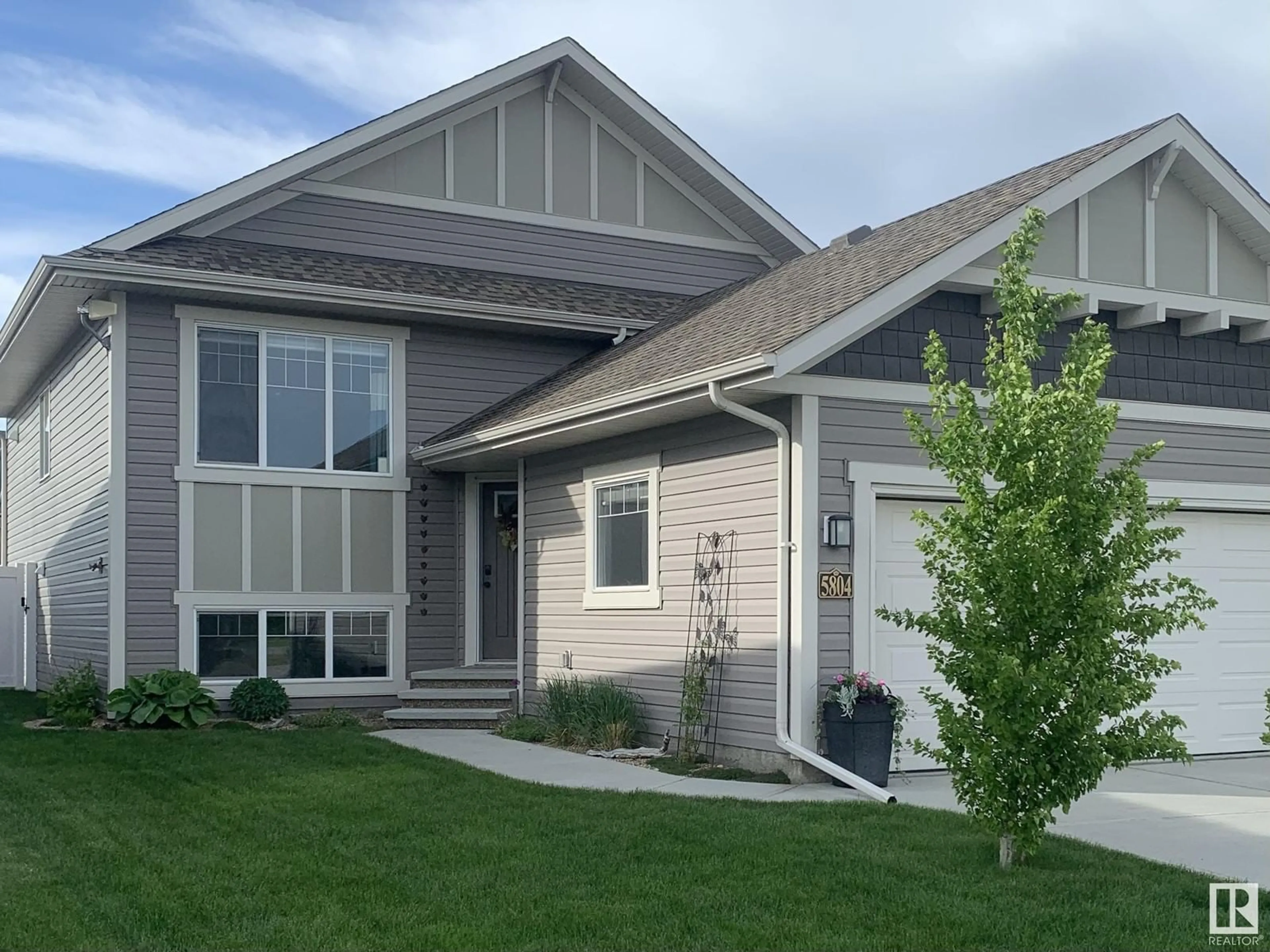 Home with vinyl exterior material, street for 5804 62 AV, Ponoka Alberta T4J0C3
