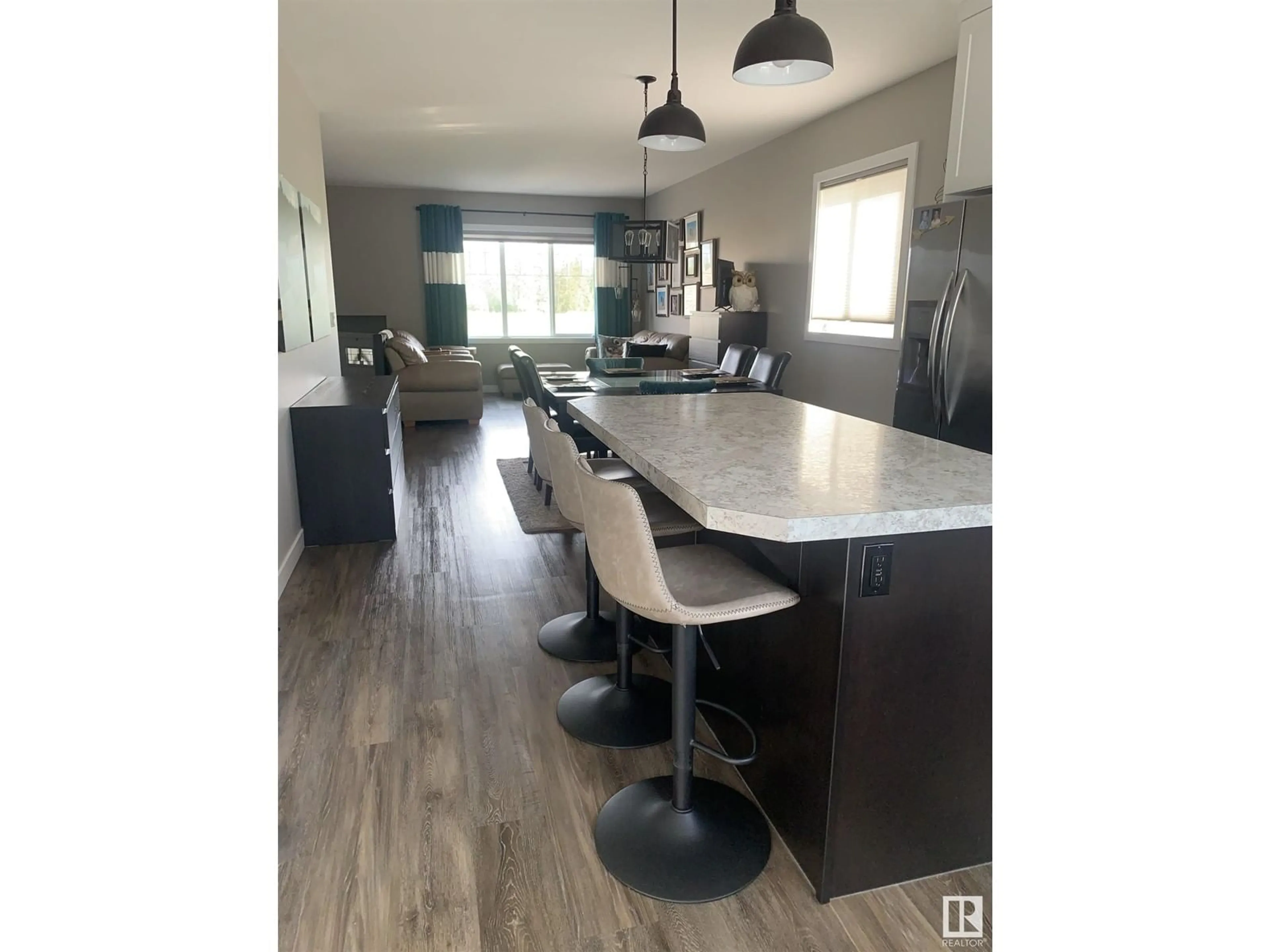 Open concept kitchen, wood/laminate floor for 5804 62 AV, Ponoka Alberta T4J0C3