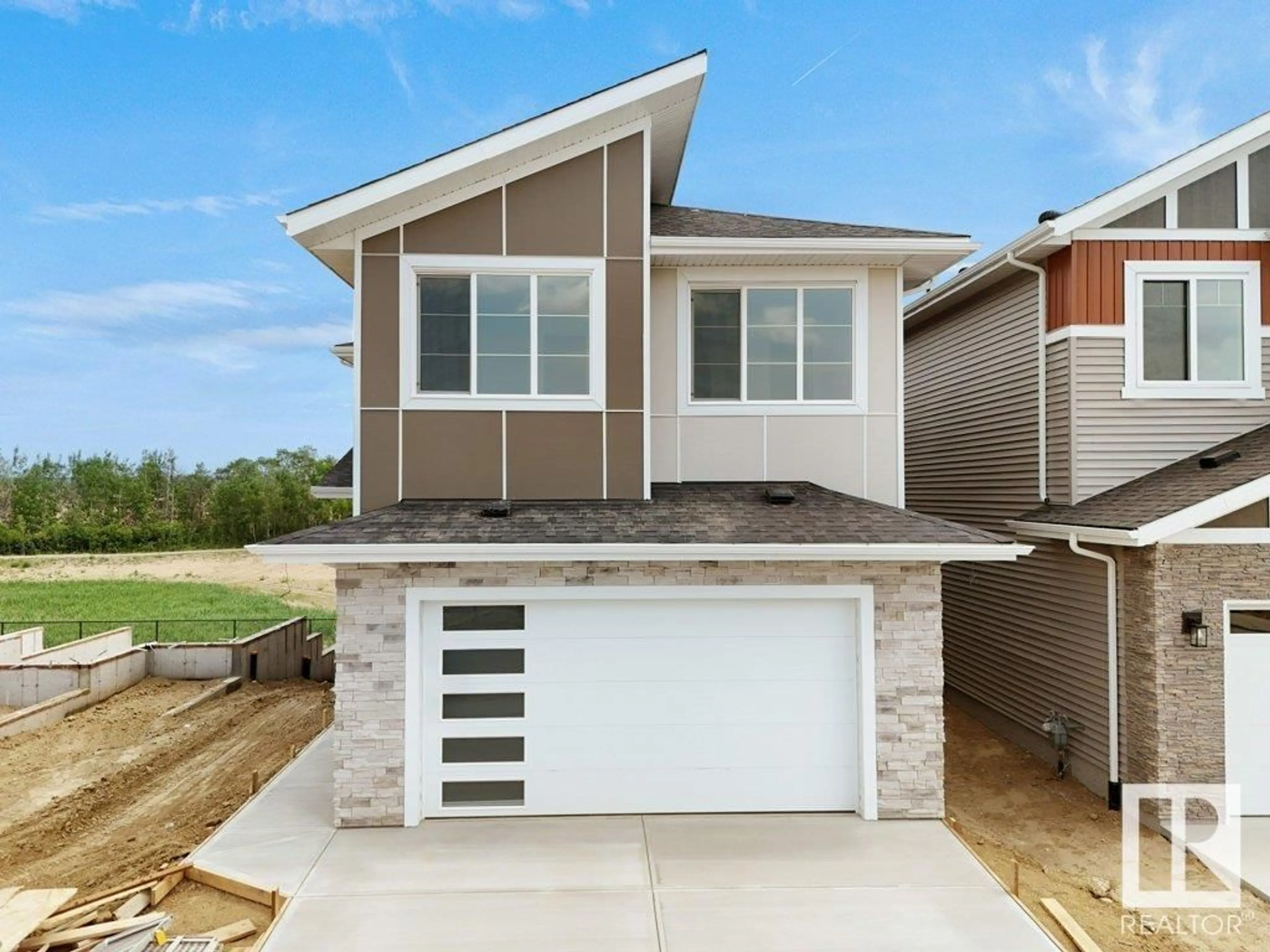Home with vinyl exterior material, street for 3313 CHICKADEE DR, Edmonton Alberta T5V1T7