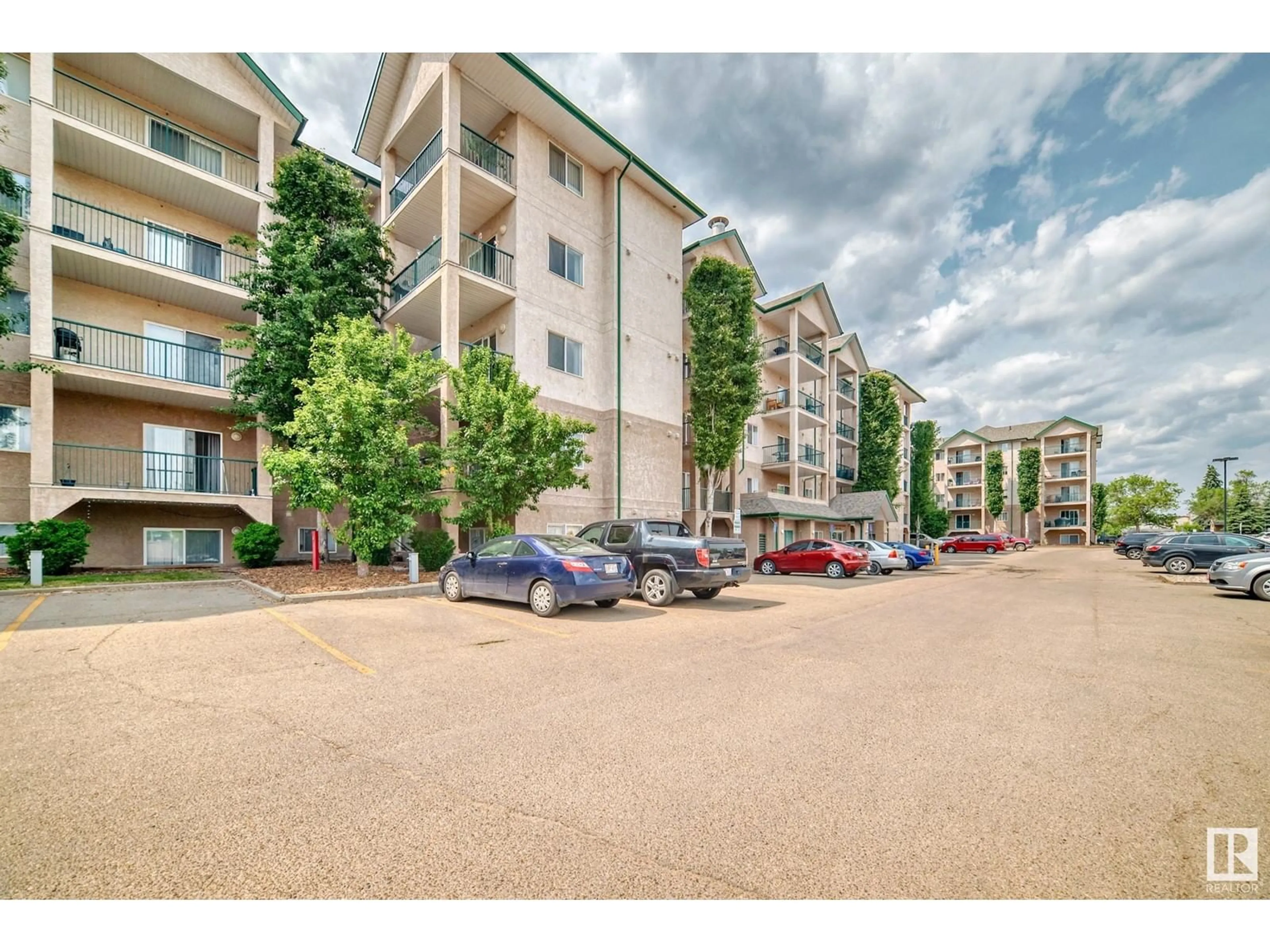 A pic from outside/outdoor area/front of a property/back of a property/a pic from drone, street for #306 - 11325 83 ST, Edmonton Alberta T5B4W5
