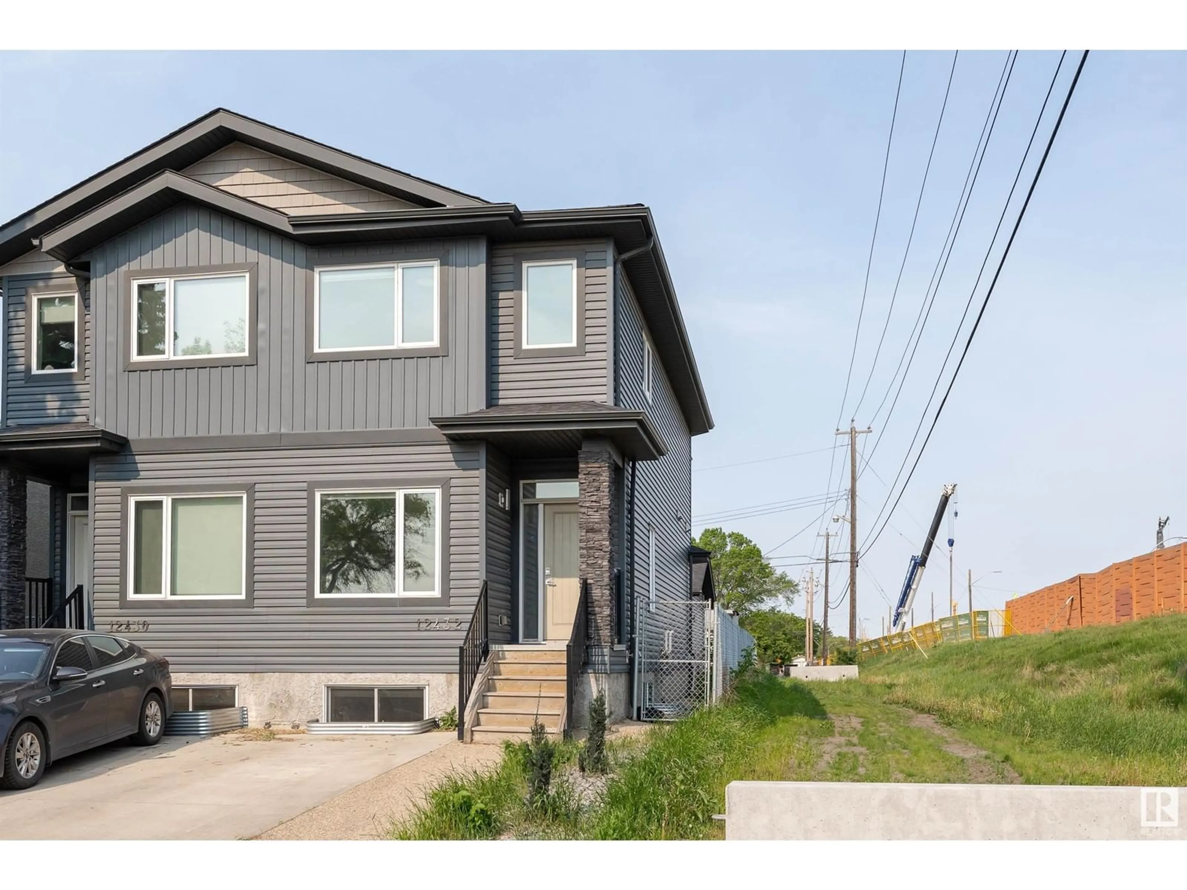 Home with vinyl exterior material, street for NW - 12432 125 ST, Edmonton Alberta T5L0T1
