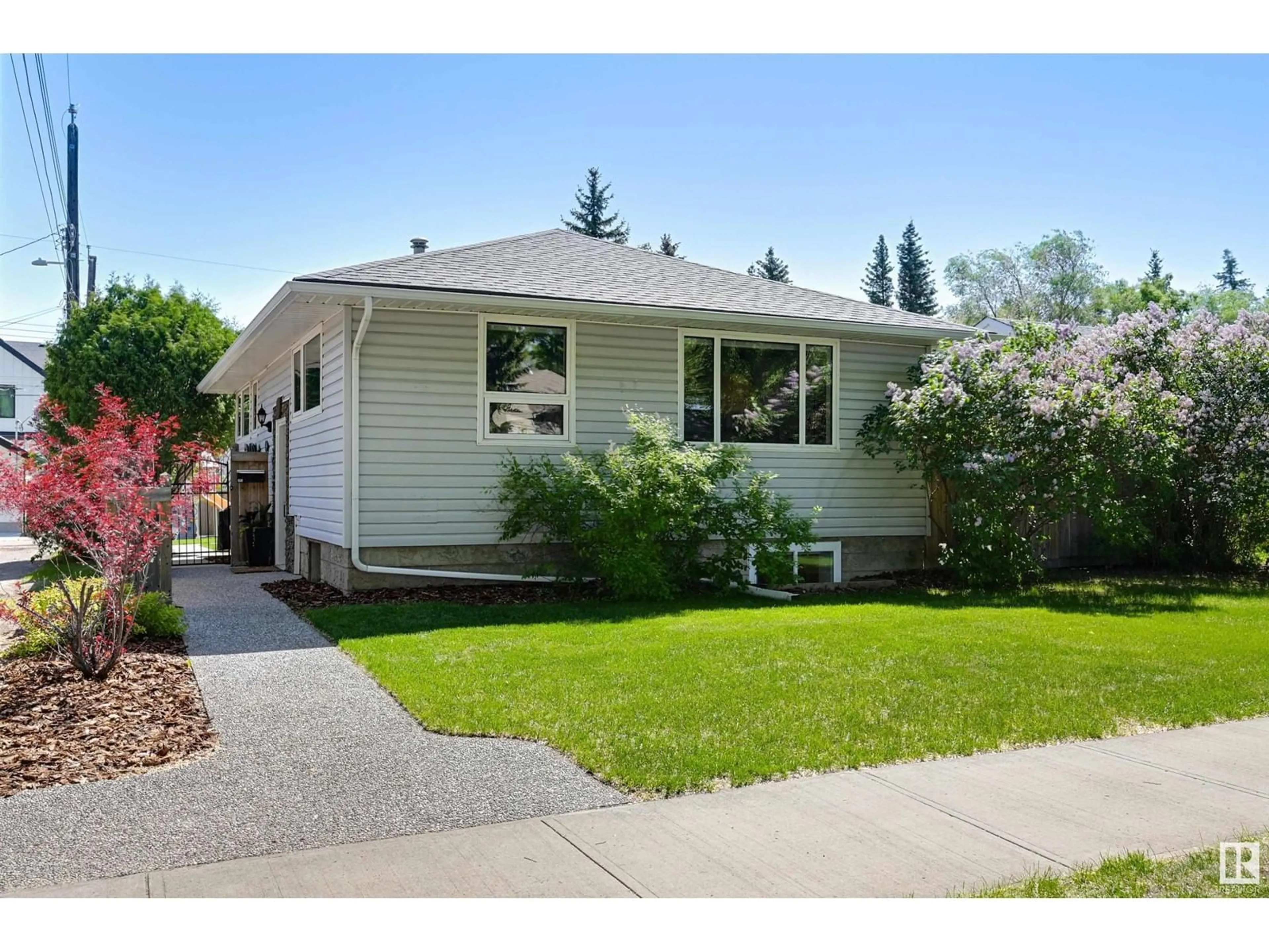 Home with vinyl exterior material, street for 9311 146 ST, Edmonton Alberta T5R0W4