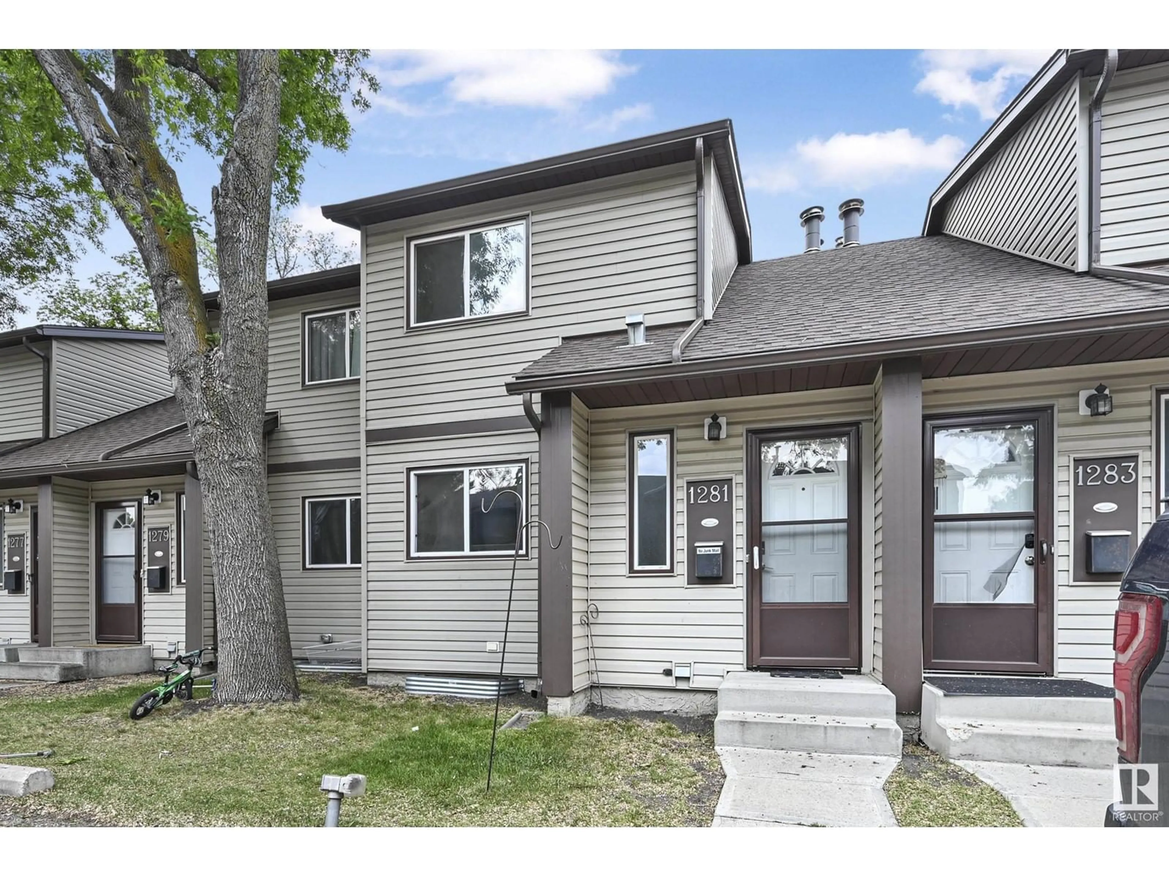 Home with vinyl exterior material, street for 1281 HOOKE RD, Edmonton Alberta T5A4A5