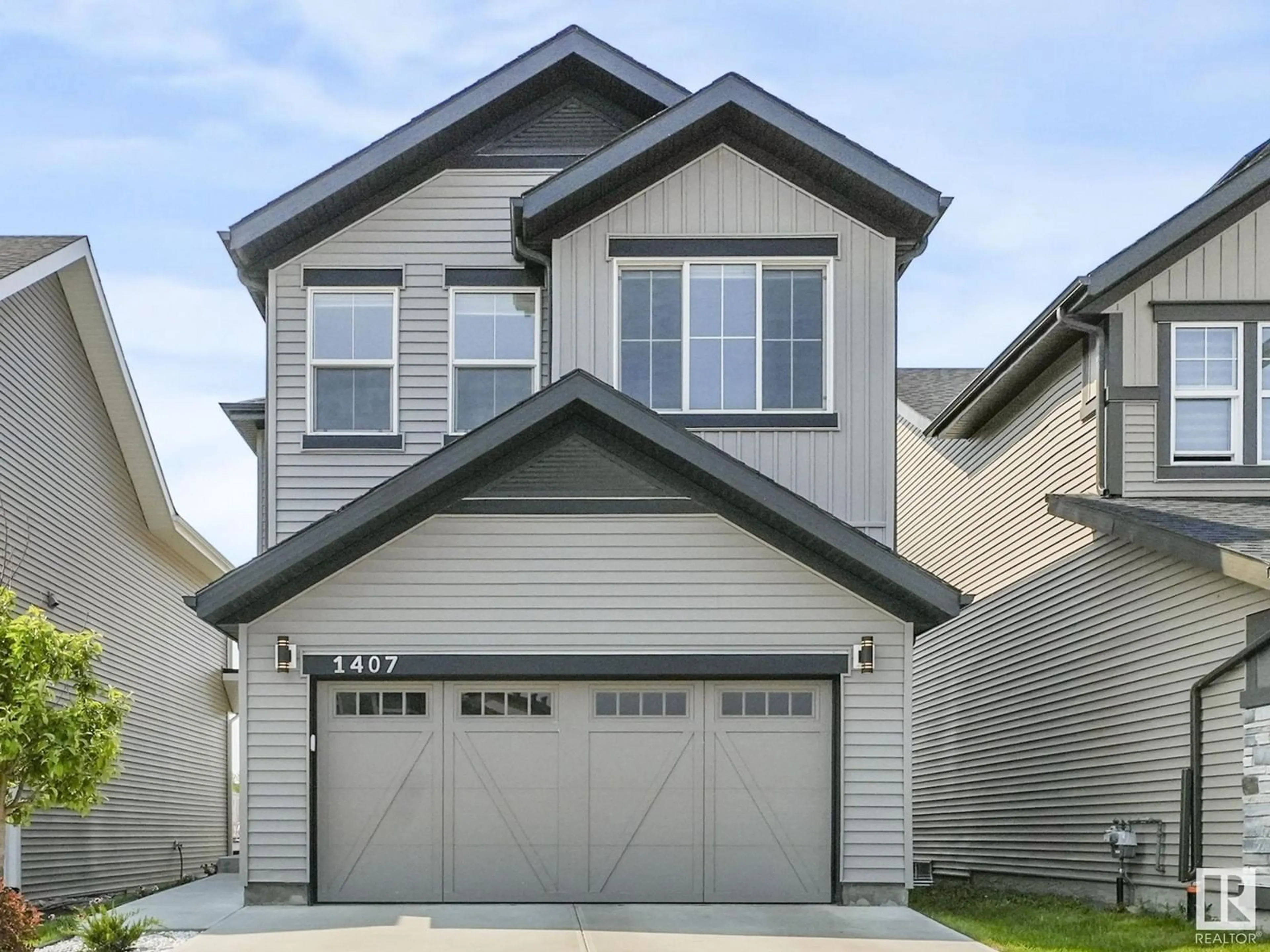 Home with vinyl exterior material, street for 1407 DARBY GR, Edmonton Alberta T6W4N4